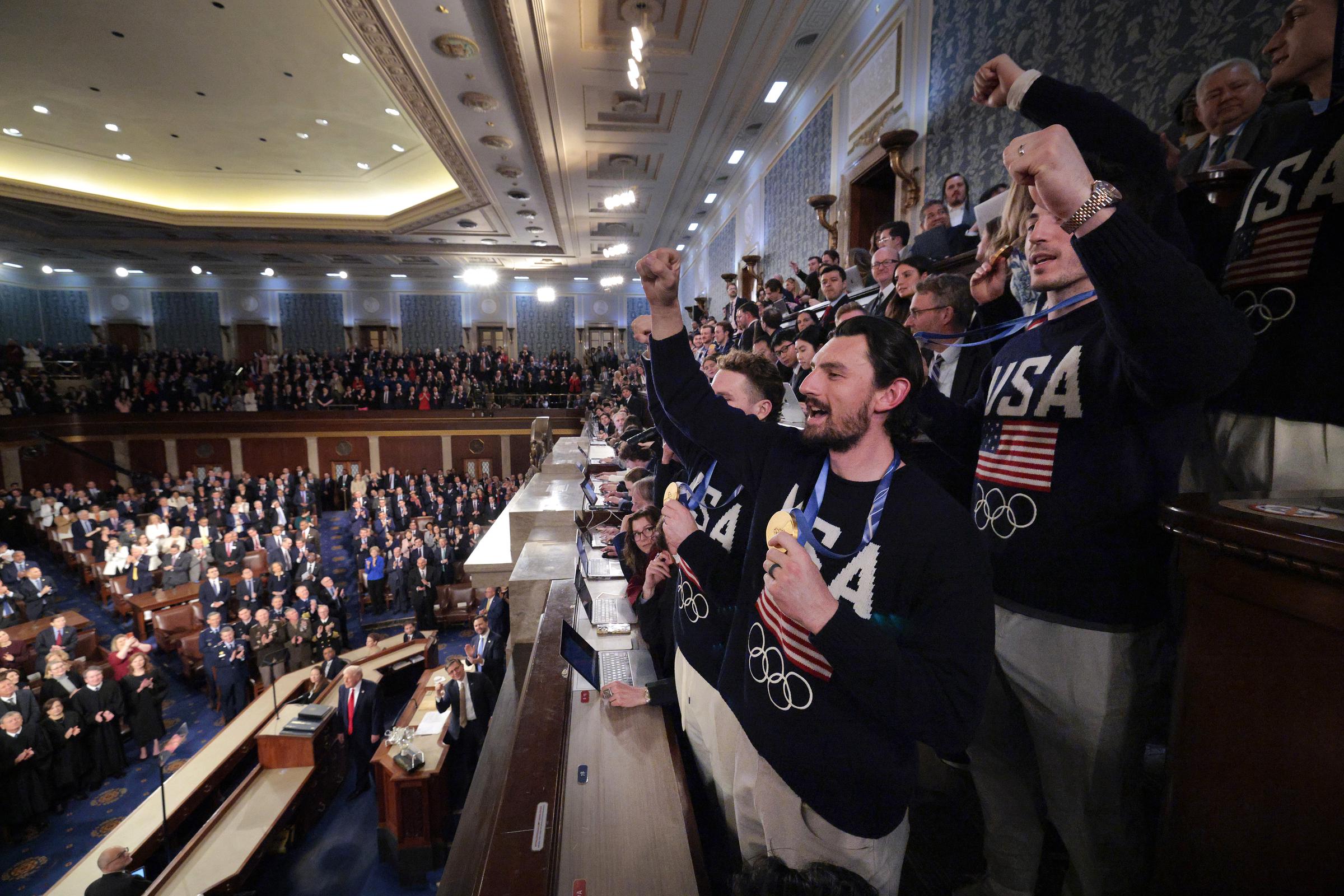 Members of Team USA’s men’s hockey team wave as President Donald Trump delivers his State of the Union address at the U.S. Capitol on February 24, 2026. | Source: Getty Images