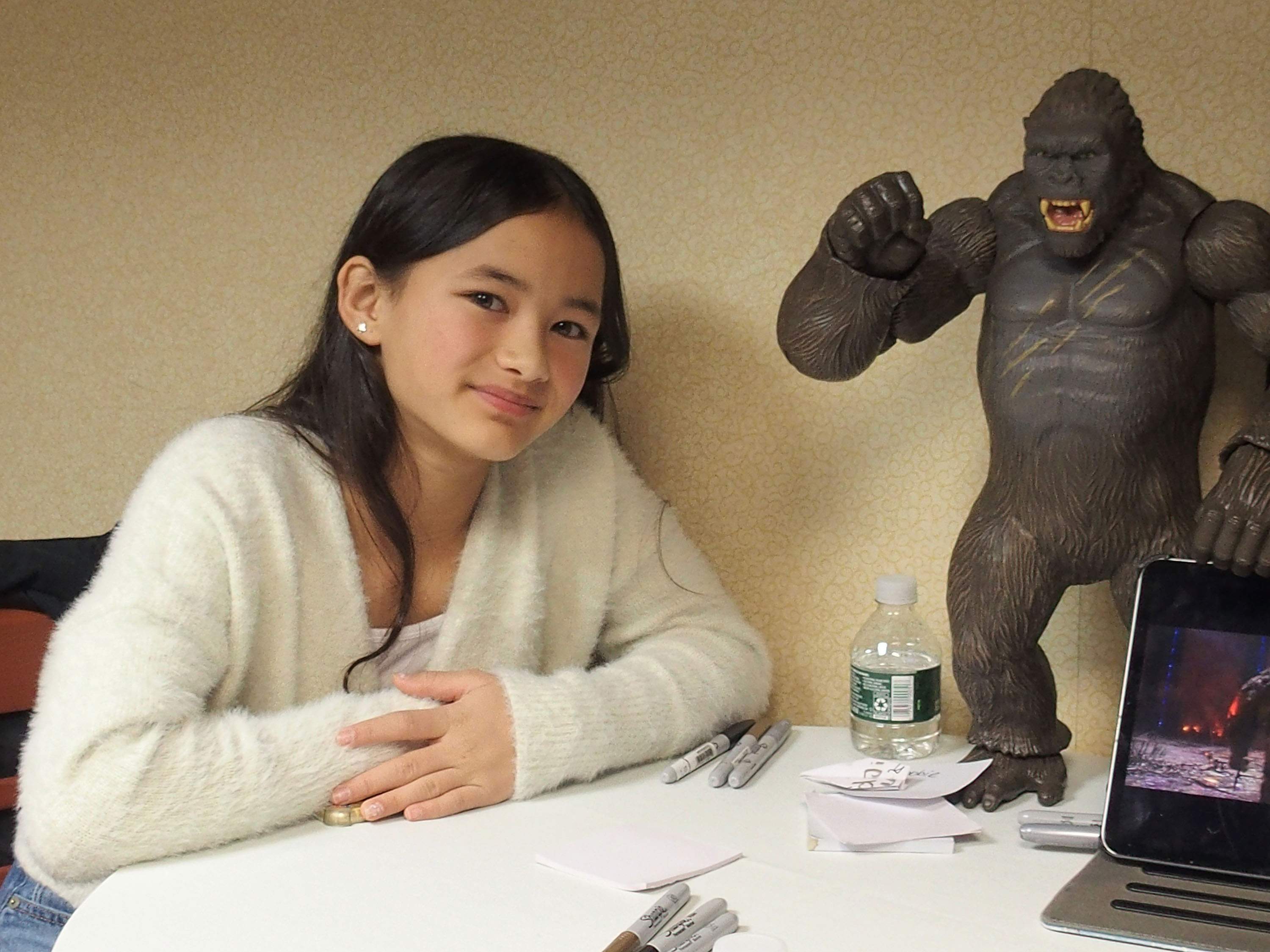 Kaylee Hottle poses alongside a King Kong figurine during promotional press for "Godzilla vs. Kong," showcasing the charm that made her an immediate fan favorite. | Source: Getty Images