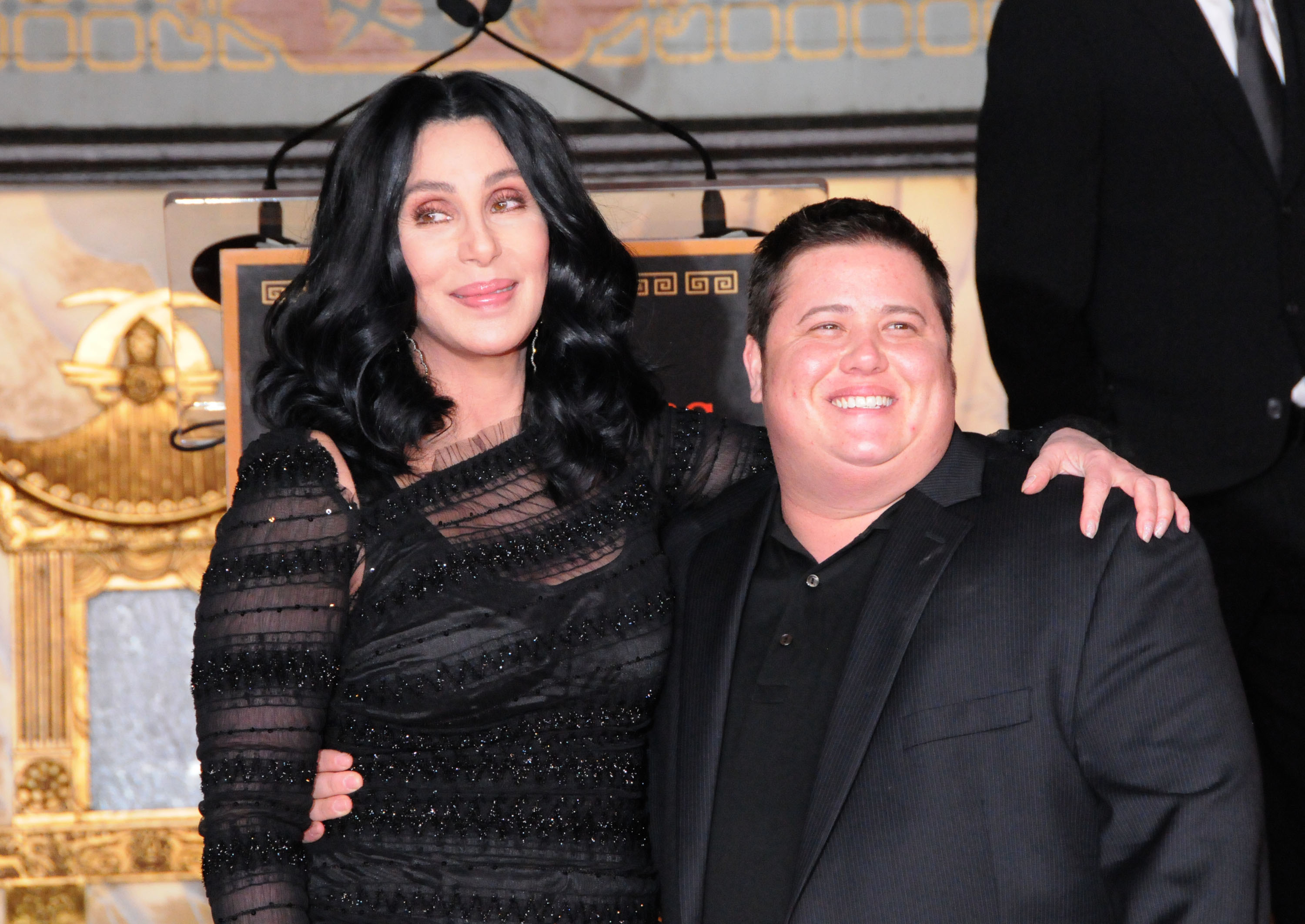 Cher and son Chaz Bono at ceremony where she is honored with a hand and footprint ceremony on November 18, 2010 | Source: Getty Images