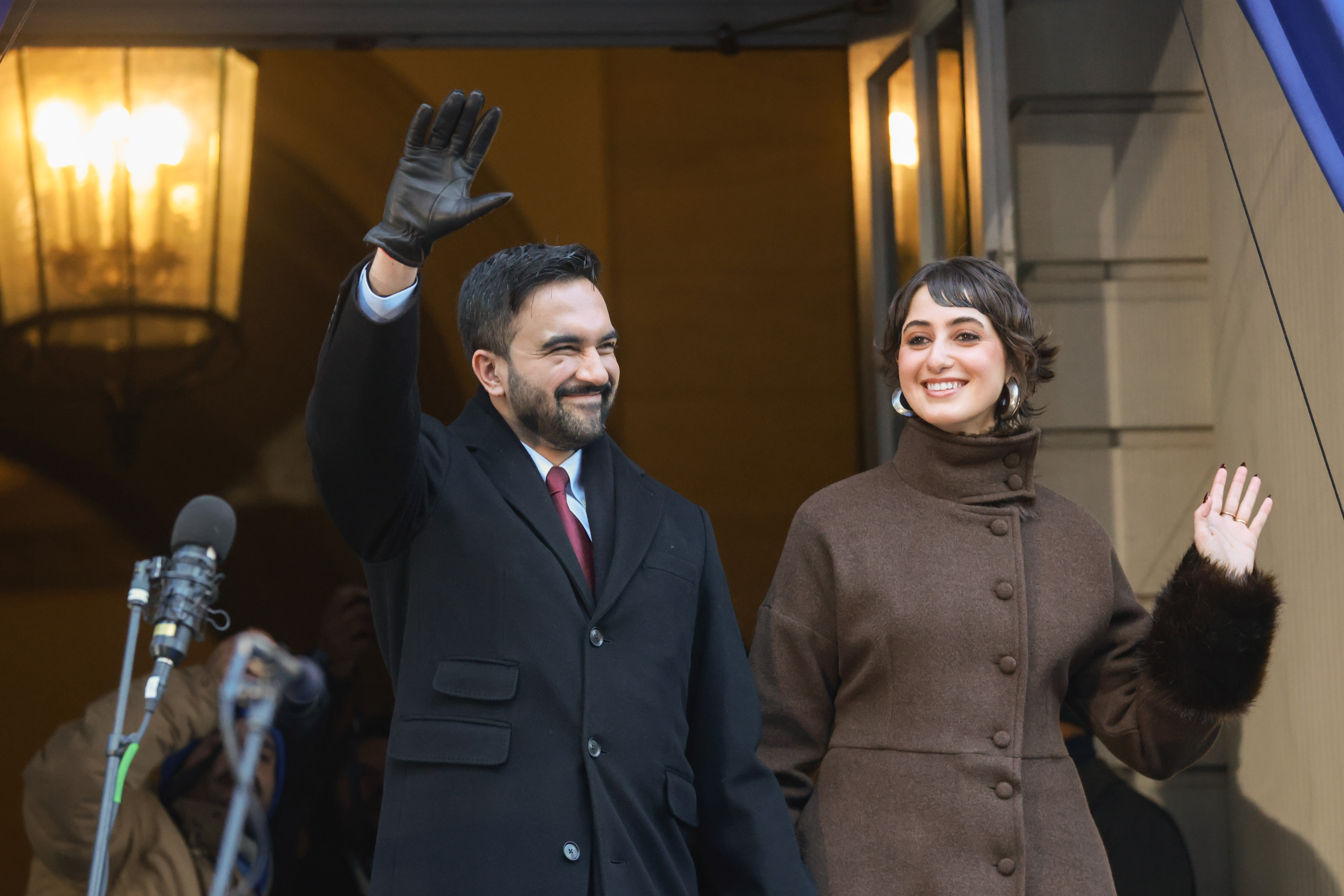 New York Mayor Zohran Mamdani and Rama Duwaji wave to the crowd during Zohran's ceremonial inauguration in New York on January 1, 2026. | Source: Getty Images