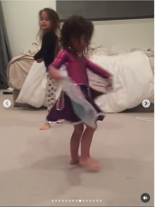A much younger Fiona is captured in a playful moment with Mabel. Fiona is dancing barefoot in a bedroom with a big smile and a makeshift costume around her. The sweet childhood scene offers another glimpse of the little girl Mabel is now remembering with love.