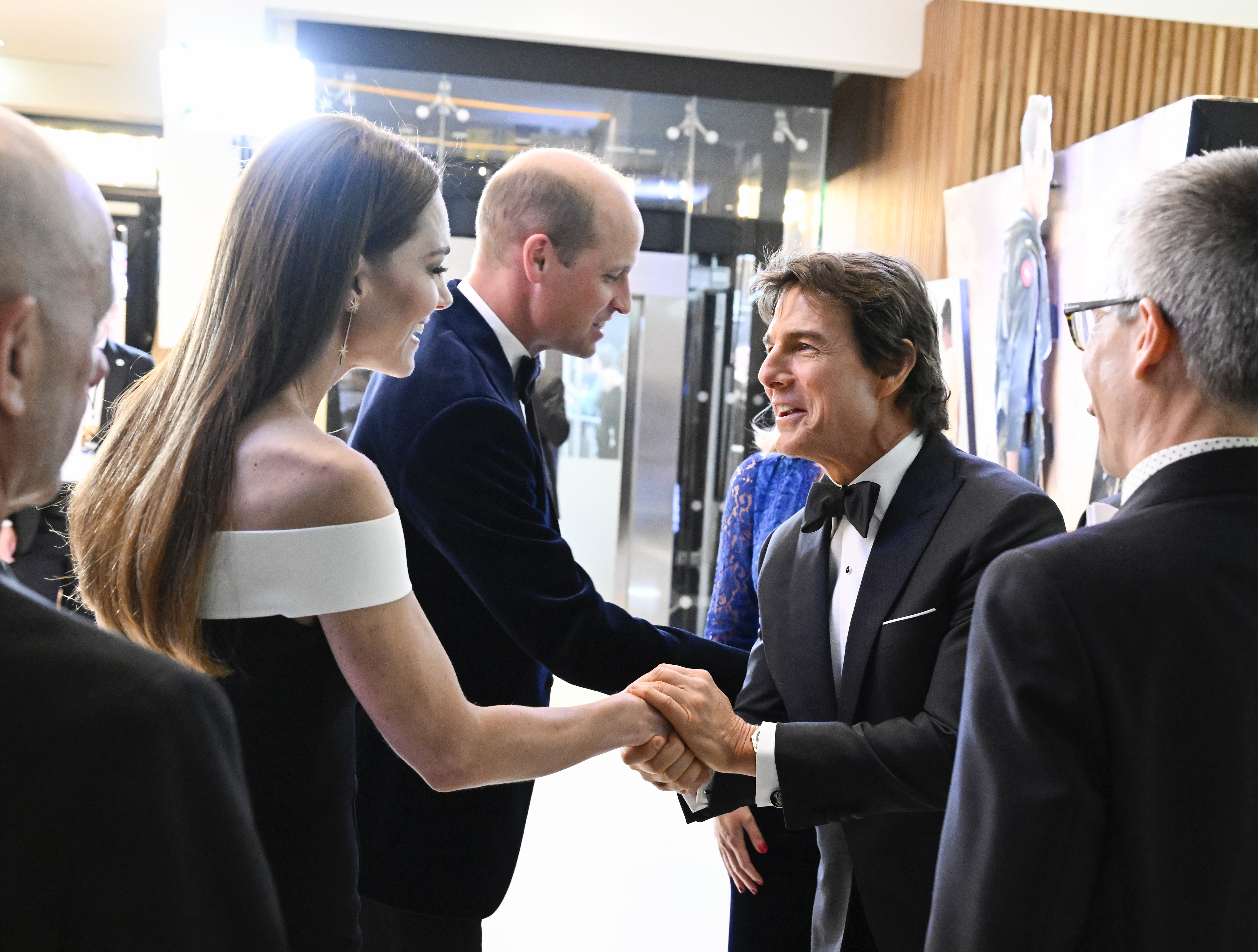 Catherine and Prince William greet Tom Cruise at the Royal Film Performance and U.K. premiere of "Top Gun: Maverick" in London's Leicester Square on May 19, 2022. The event was the couple's previous joint movie-premiere appearance before reuniting with Tom at the "Digger" premiere more than four years later. | Source: Getty Images