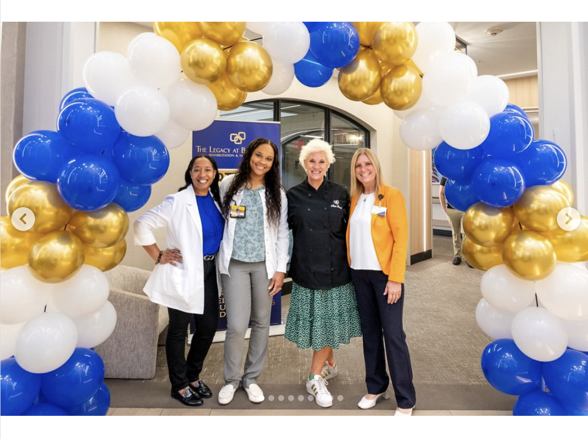 Anne Burrell is seen with staff members of CareRite Center, in a photo shared on June 11, 2025 | Source: Instagram/careritecenters