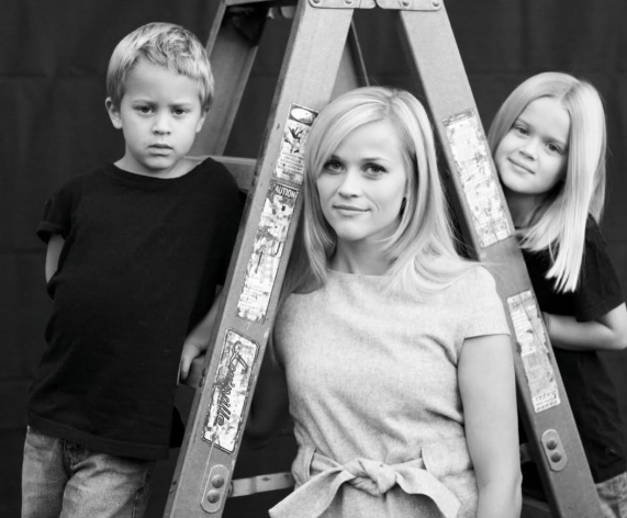 Deacon appears alongside Reese and Ava in an early family portrait, with the trio posing around a ladder. The image captures the mother and siblings together years before Deacon's Nashville premiere. | Source: Instagram/Deaconphillippe