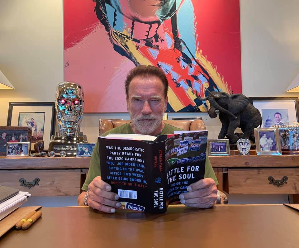 Arnold Schwarzenegger reads Battle for the Soul in a photo posted on May 27, 2021 | Source: Facebook/arnold
