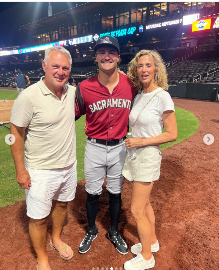 Claude Lemieux and his wife, Deborah, pose with a younger family member on the field following a sporting event. | Source: Instagram/claudialemieuxbishop