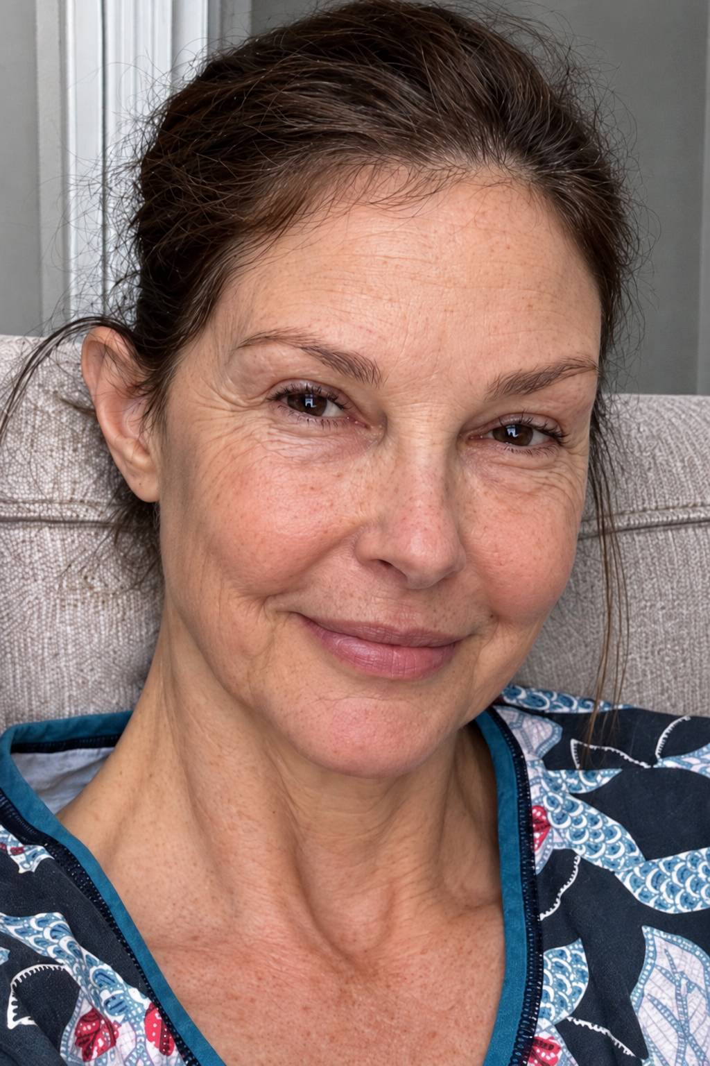 A computer-generated selfie-style portrait uses a close camera angle to bring Judd's expression into focus.