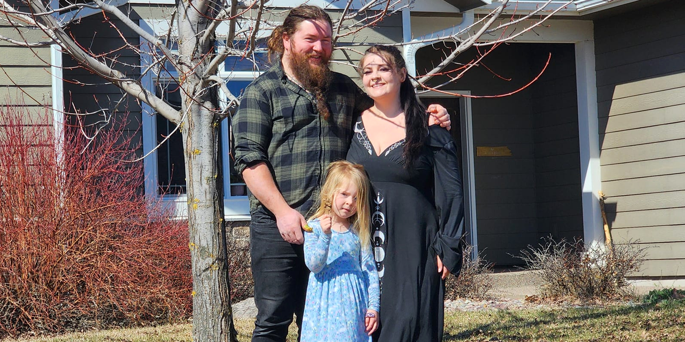 Nicholas and Katie Olson-Hartley with one of their daughters. | Source: Facebook/Katie Jean Olson
