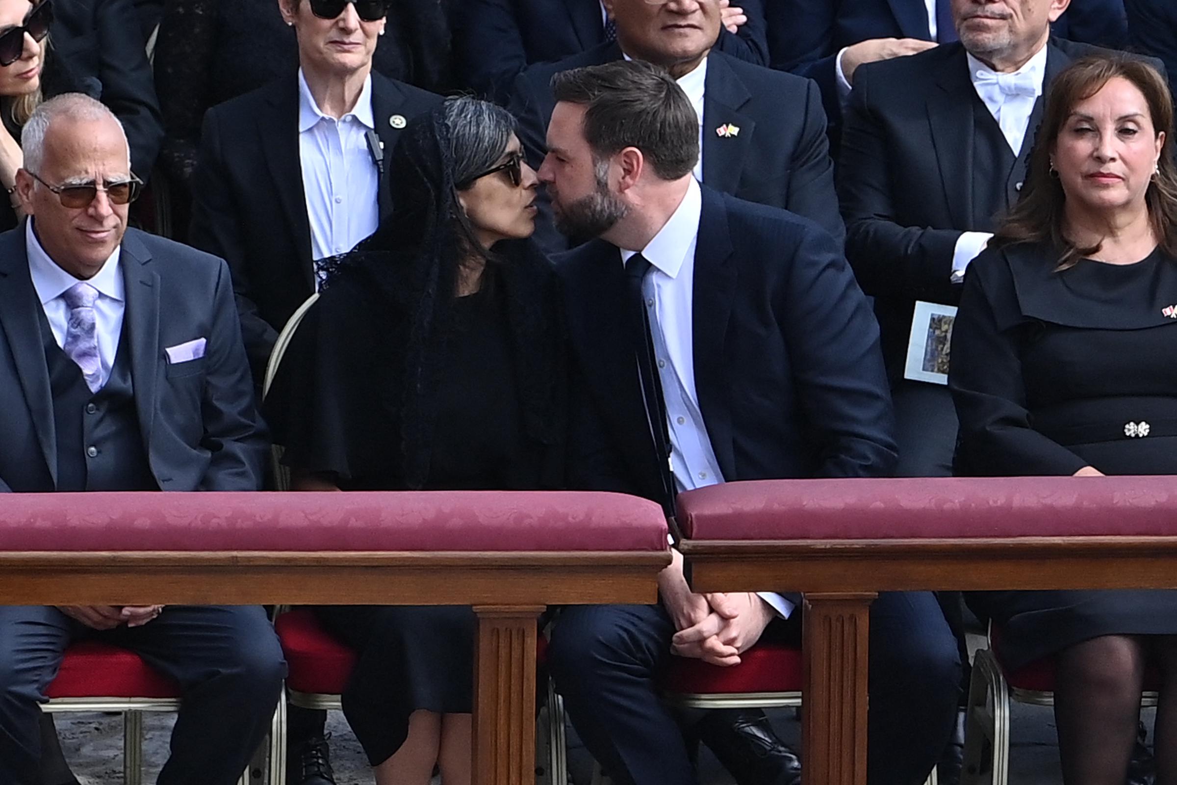 JD Vance kisses his wife Usha Vance as they attend a Holy Mass for the Beginning of the Pontificate of Pope Leo XIV, in St Peter's square in The Vatican on May 18, 2025 | Source: Getty Images