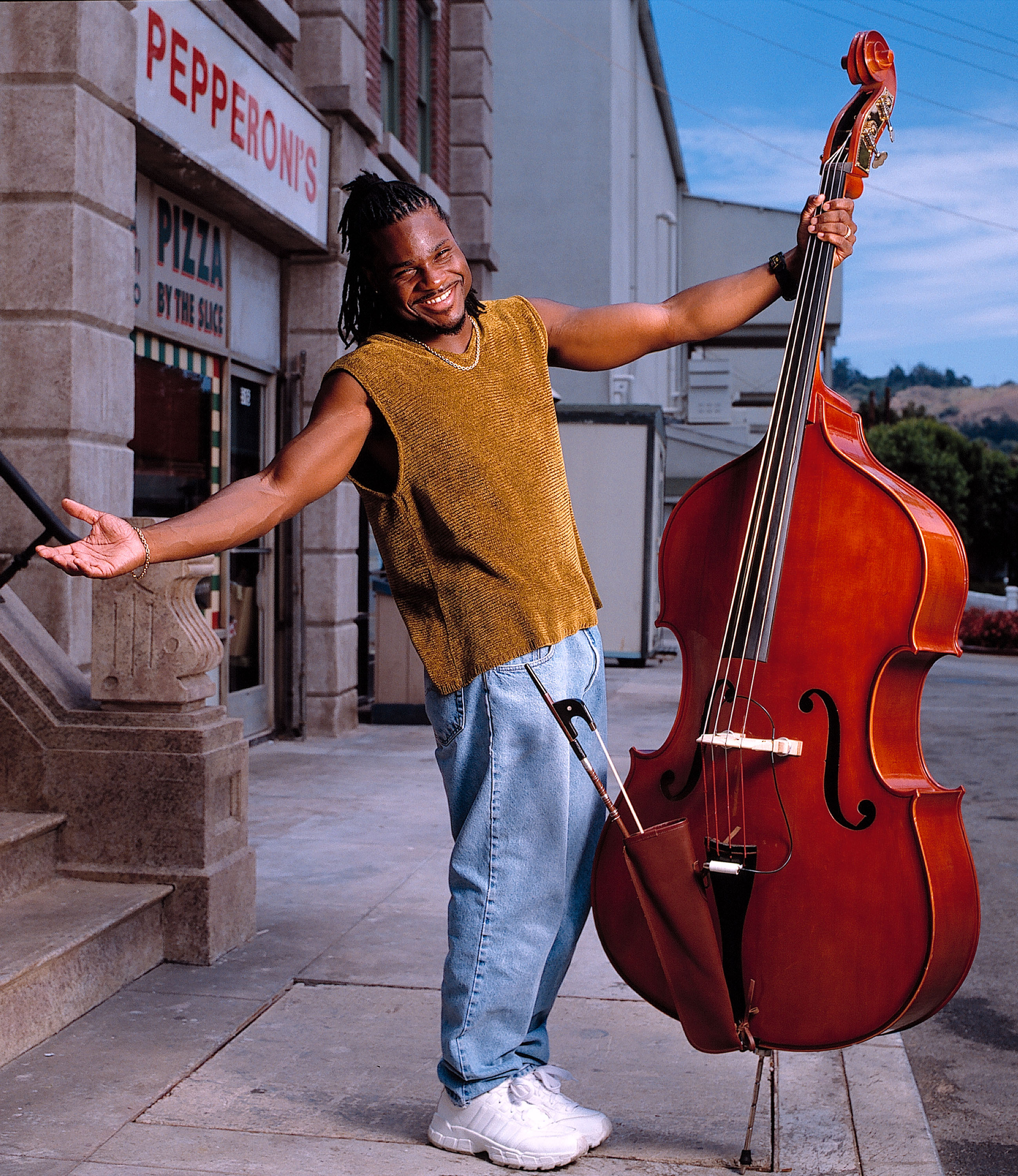 Malcolm-Jamal Warner poses with his bass on July 9, 1999 in Sherman Oaks, California | Source: Getty Images