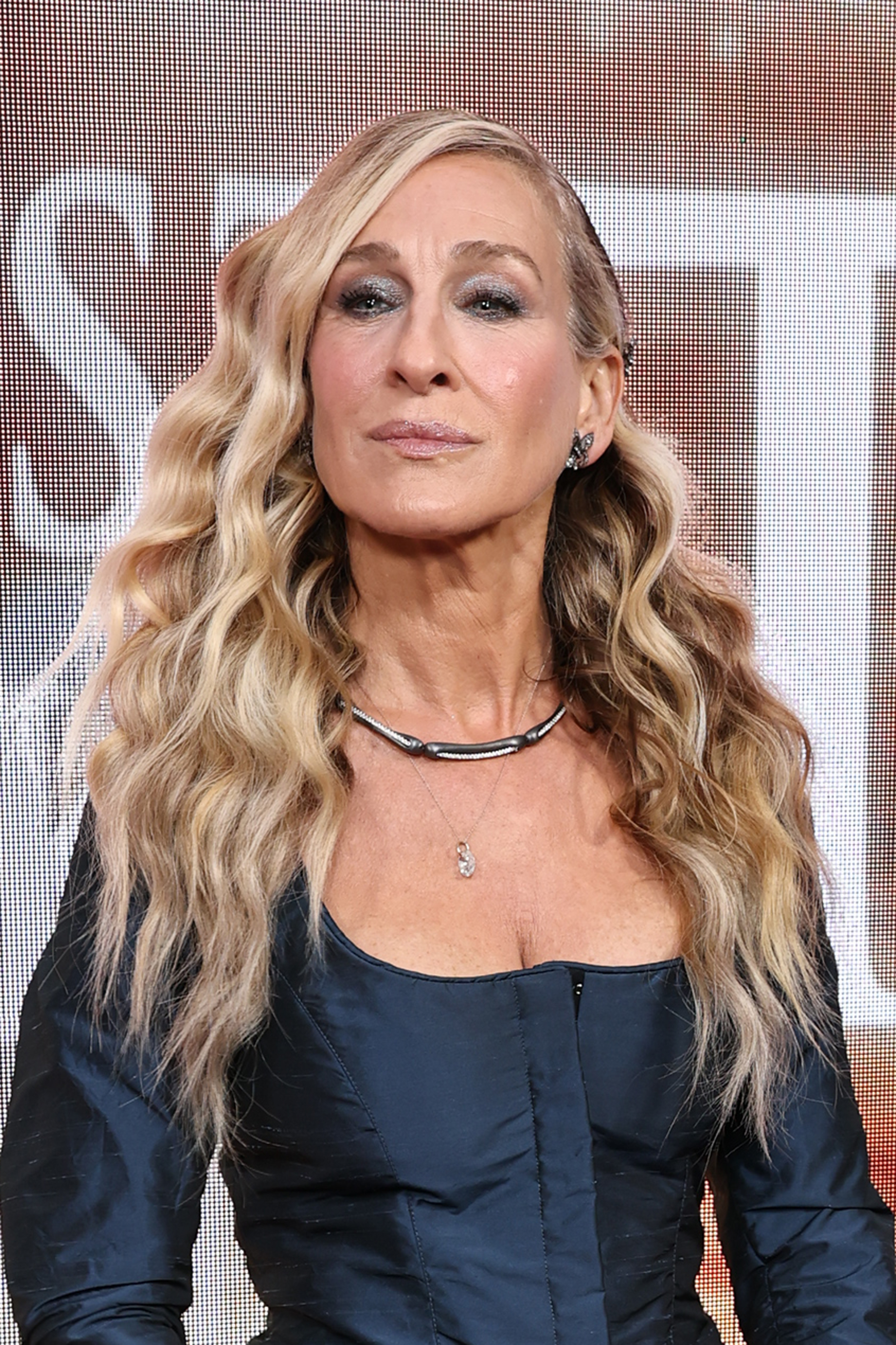 A close-up of Sarah Jessica Parker's makeup at the "And Just Like That..." photo call shows her silvery smoky eye and matching sparkling pink lip.