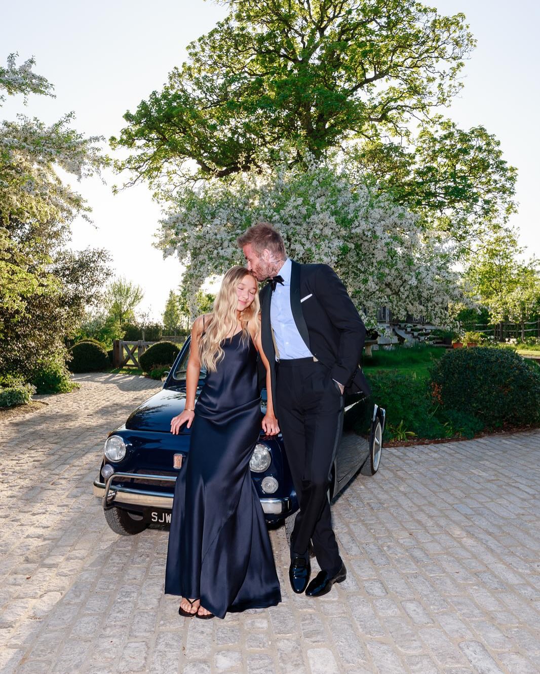 Harper and David Beckham from a post dated May 4, 2025. | Source: Instagram/victoriabeckham