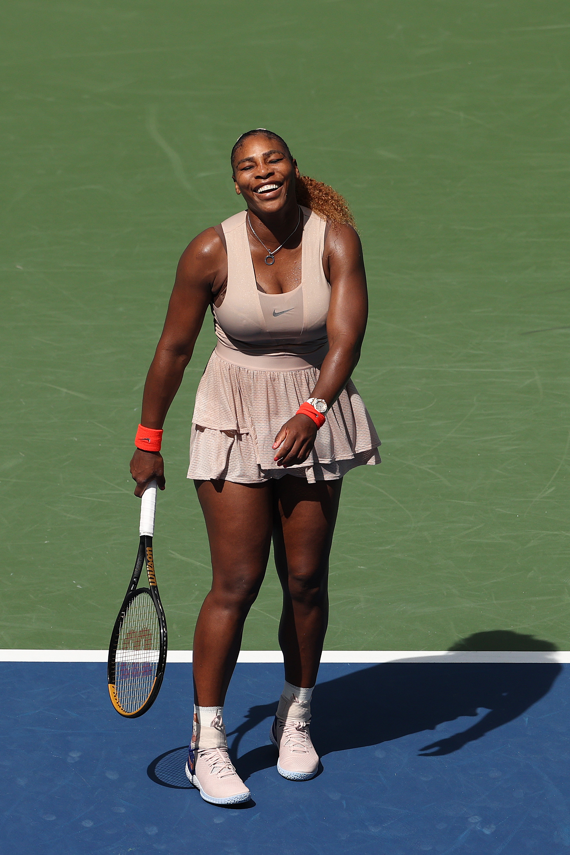 Serena Williams radiates joy as she laughs heartily during her Women’s Singles fourth-round match against Maria Sakkari on Day Eight of the US Open at the USTA Billie Jean King National Tennis Center in Queens, New York City.
