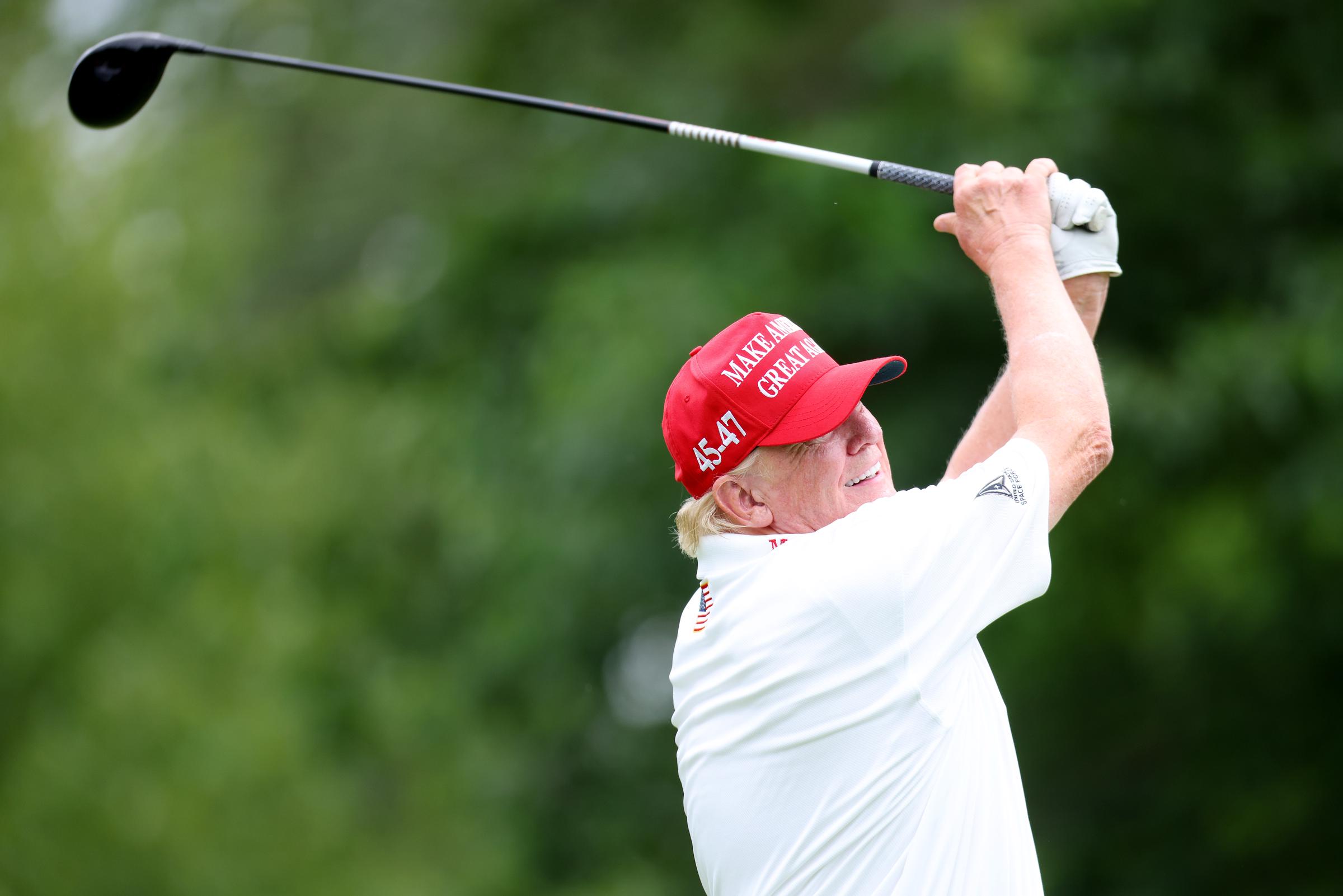 Donald Trump follows his tee shot during the pro-am prior to the LIV Golf Invitational - Bedminster on August 10, 2023, in New Jersey | Source: Getty Images