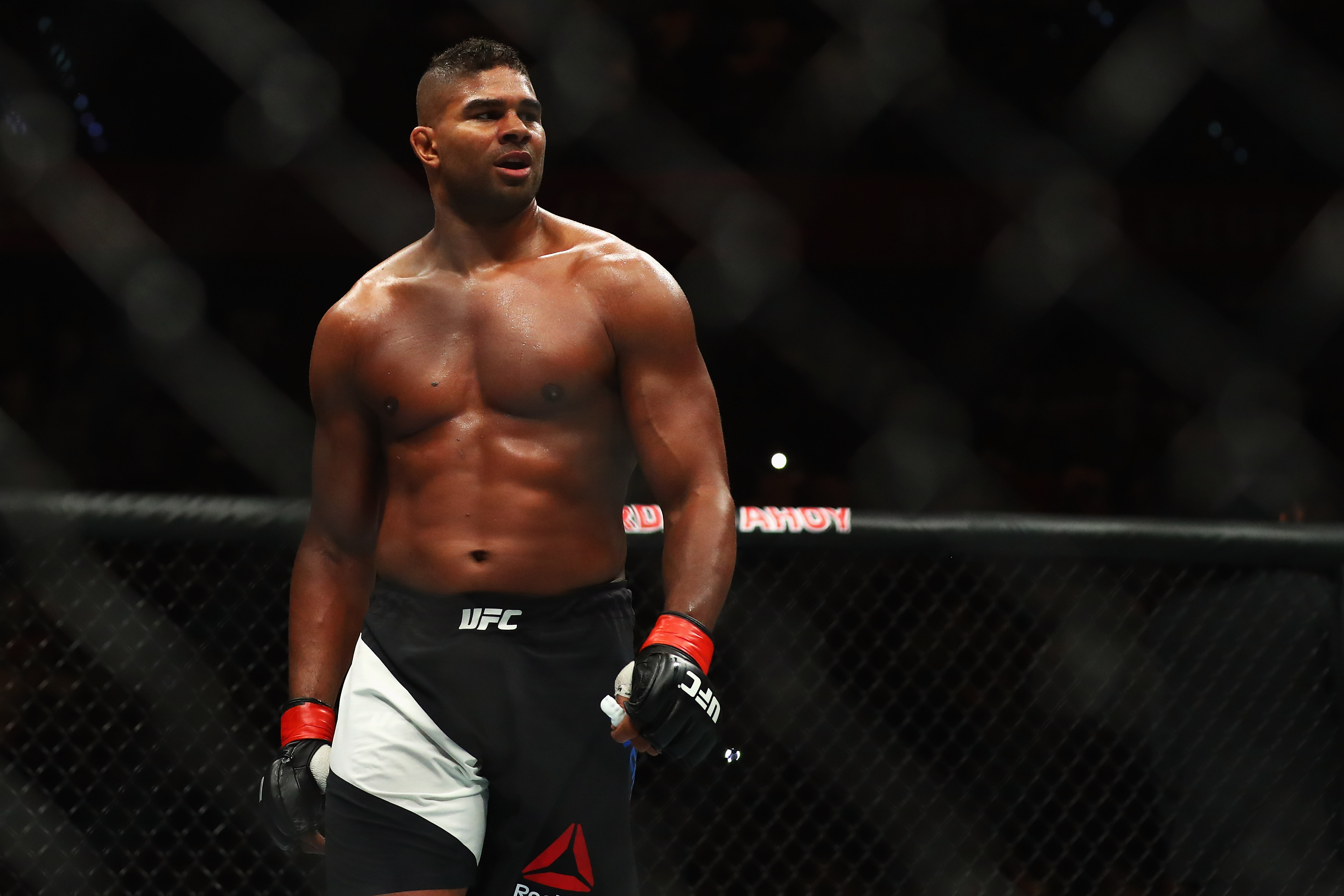Alistair Overeem remained a commanding heavyweight presence as he celebrated his victory over Andrei Arlovski during UFC Fight Night 87 at Ahoy in Rotterdam, Netherlands, on May 8, 2016. The Dutch fighter displayed the broad shoulders, muscular arms, and powerful torso that characterized his physique throughout much of his UFC run. His build at the time reflected years of heavyweight competition, making his eventual transformation after leaving the sport particularly pronounced.
