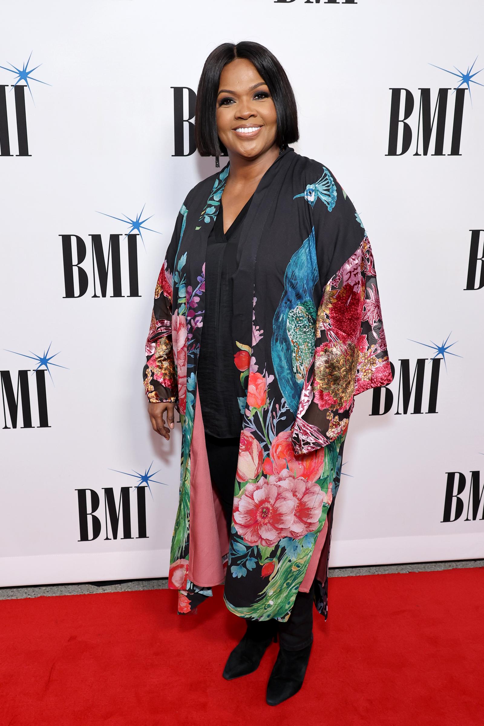 CeCe Winans beams directly at the camera while posing on the red carpet at BMI's Trailblazers of Gospel Music Awards in Nashville, Tennessee, on March 31, 2022.