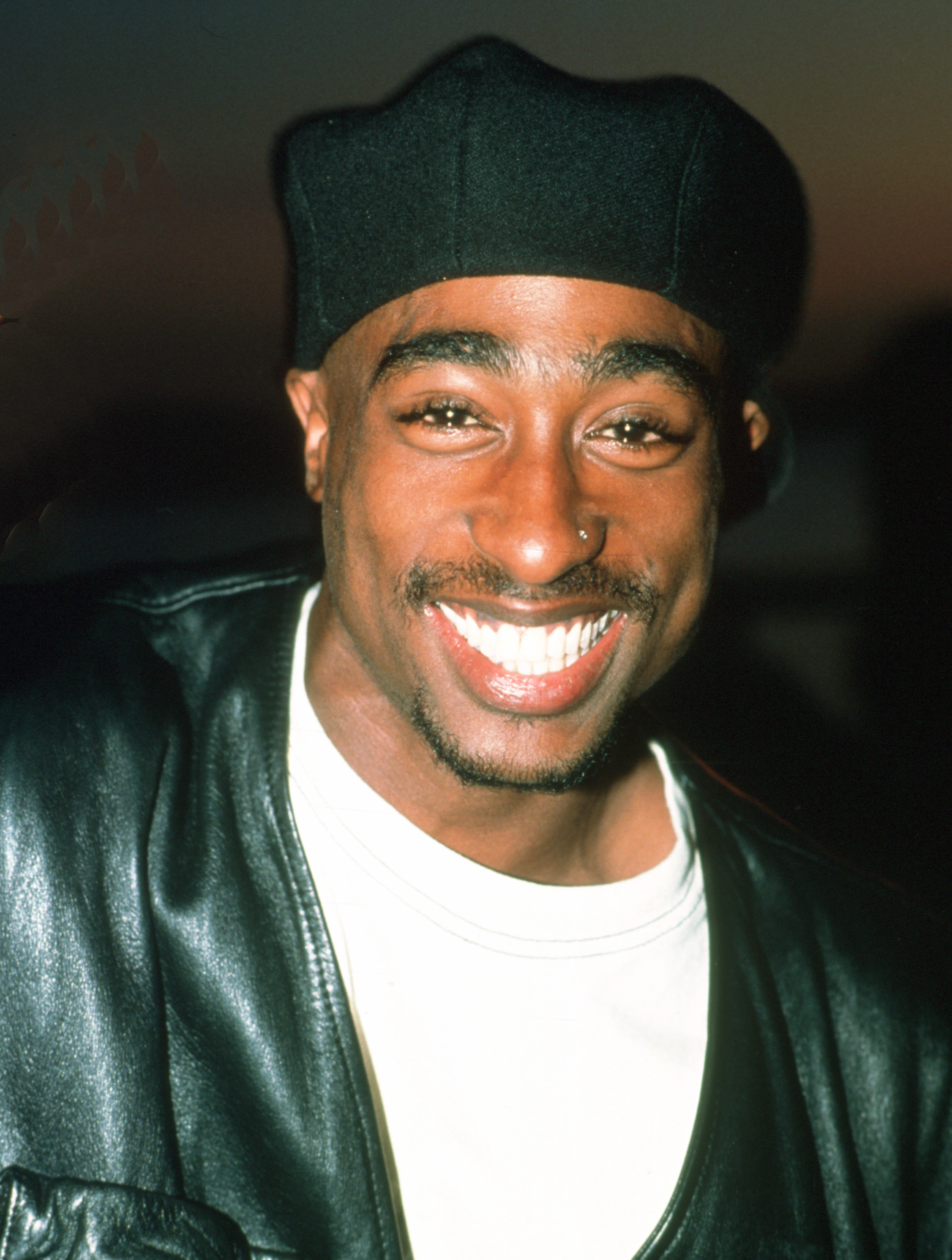 The tension peaked when Tupac showed up an hour late to film an intimate love scene with a large bandage on his chest. | Source: Getty Images
