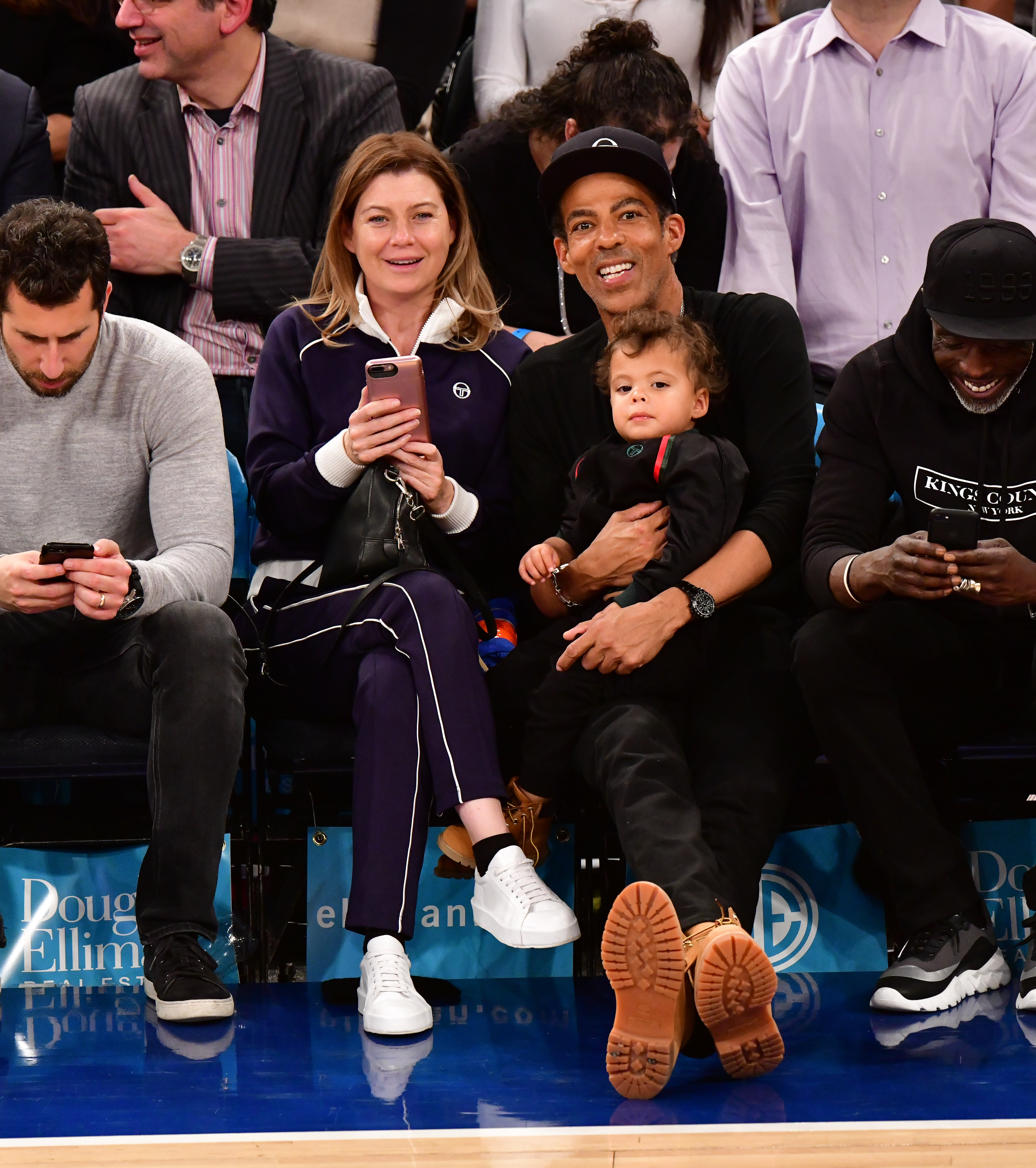 Ellen Pompeo, Eli, and Chris Ivery attend a basketball game on November 20, 2018, in New York City. | Source: Getty Images