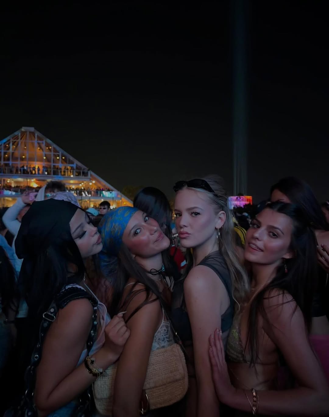 Harlow Winter Kate Madden poses with friends at Coachella 2026 as the group gathers for a nighttime festival photo. Standing close together in event-ready looks, they smile and lean into one another in the crowd. | Source: Instagram/katemaddennn