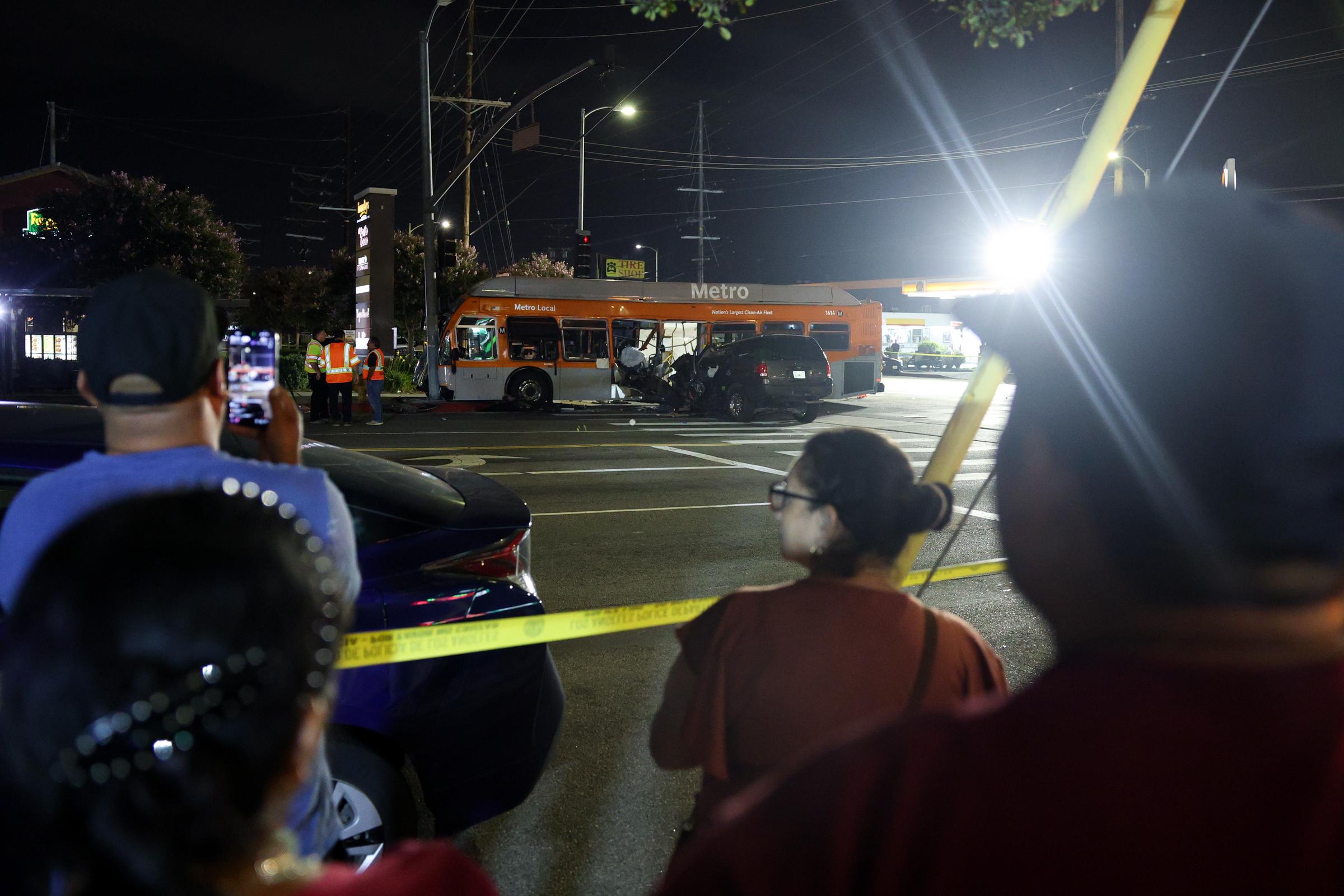 Bystanders watch as police and LA Metro investigate the scene of a crash with a LA Metro Bus that left three people dead on September 15, 2026 in Chatsworth, Los Angeles, on Tuesday evening, shortly before the NBC4 news helicopter crashed nearby. | Source: Getty Images