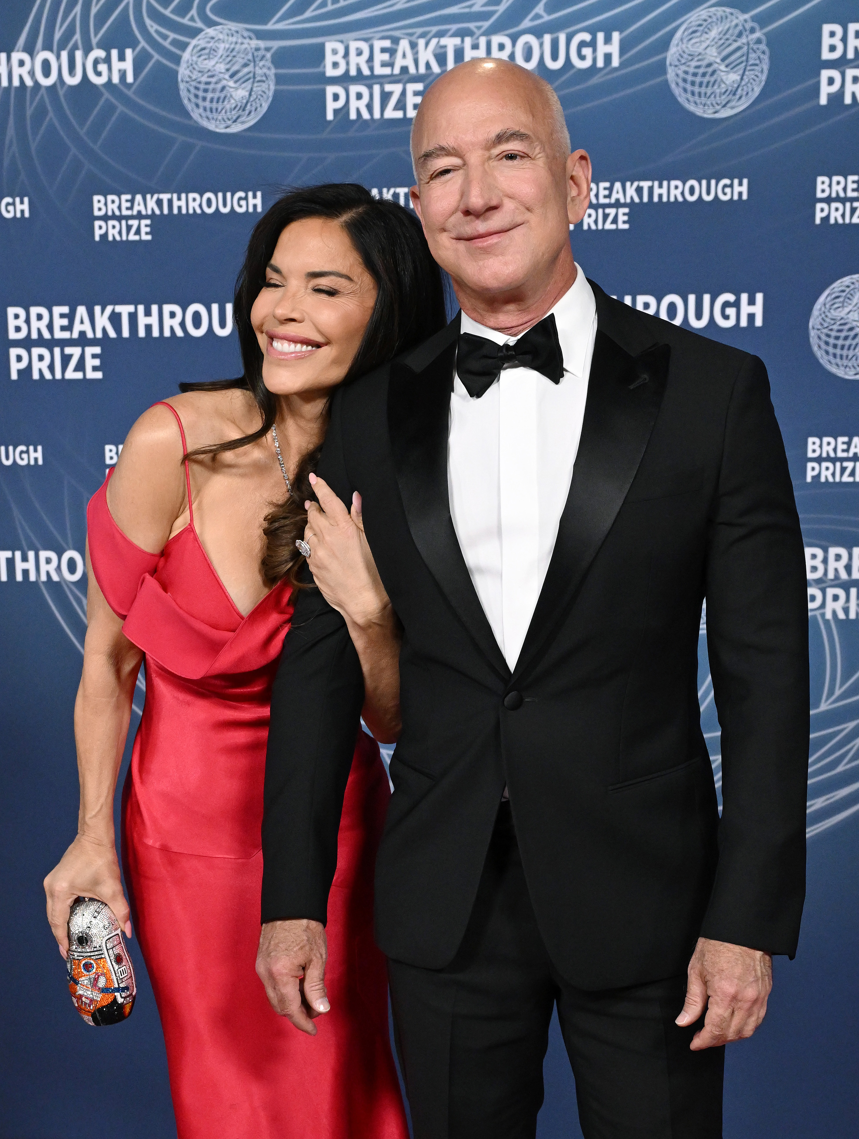 Lauren Sanchez and Jeff Bezos share a light moment on the red carpet at the 11th Breakthrough Prize Ceremony at Barker Hangar on April 5, 2025, in Santa Monica, California | Source: Getty Images