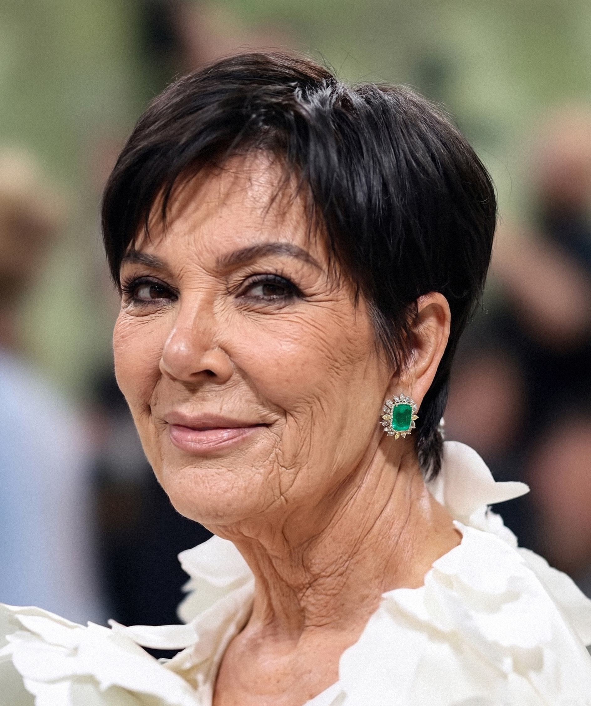A close-up imagined without cosmetic procedures, with visible lines around the eyes and mouth bringing a distinctly natural quality to Kris Jenner’s familiar look. | Source: Gemini