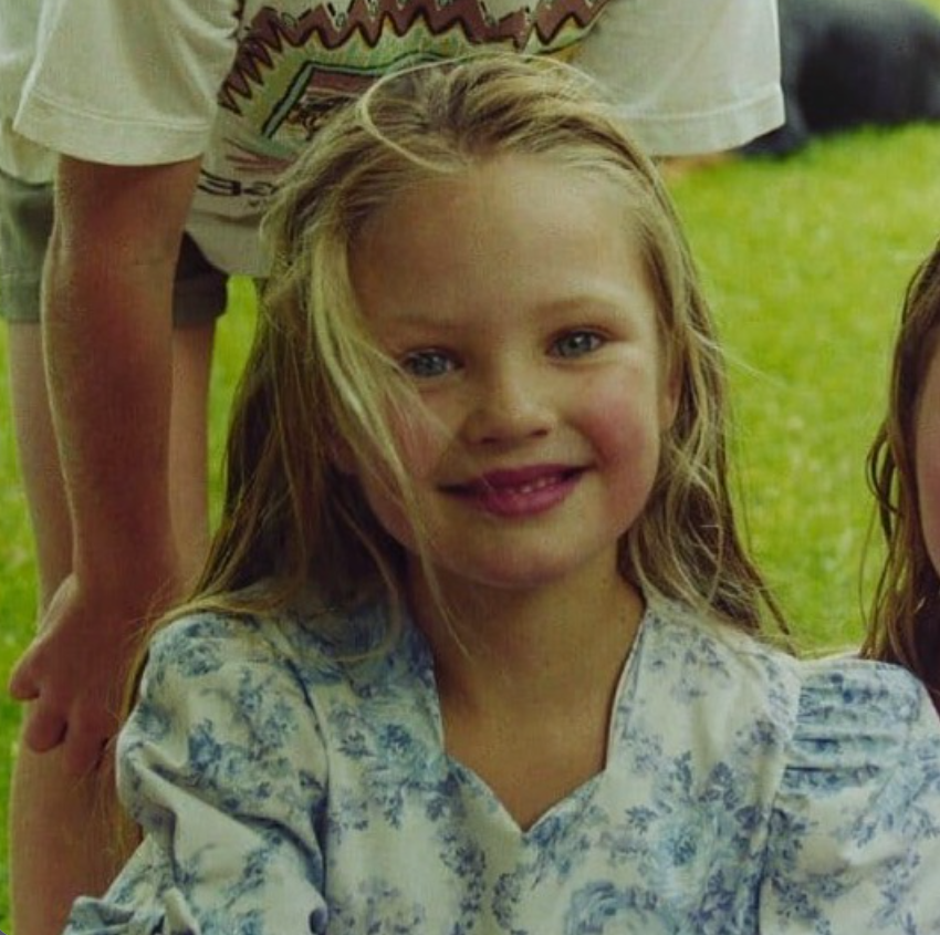 A childhood photo captures Candice Swanepoel smiling outdoors, offering a glimpse of her early years in South Africa before her rise to international modeling fame. | Source: Instagram/candiceswanepoel