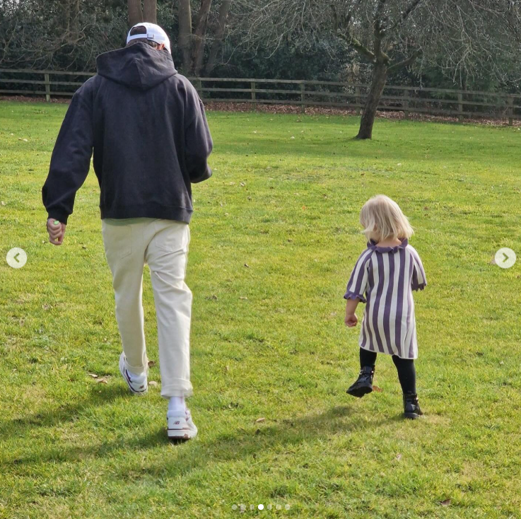 Liam Payne walking through a park with a young child. | Source: Instagram/@np2788