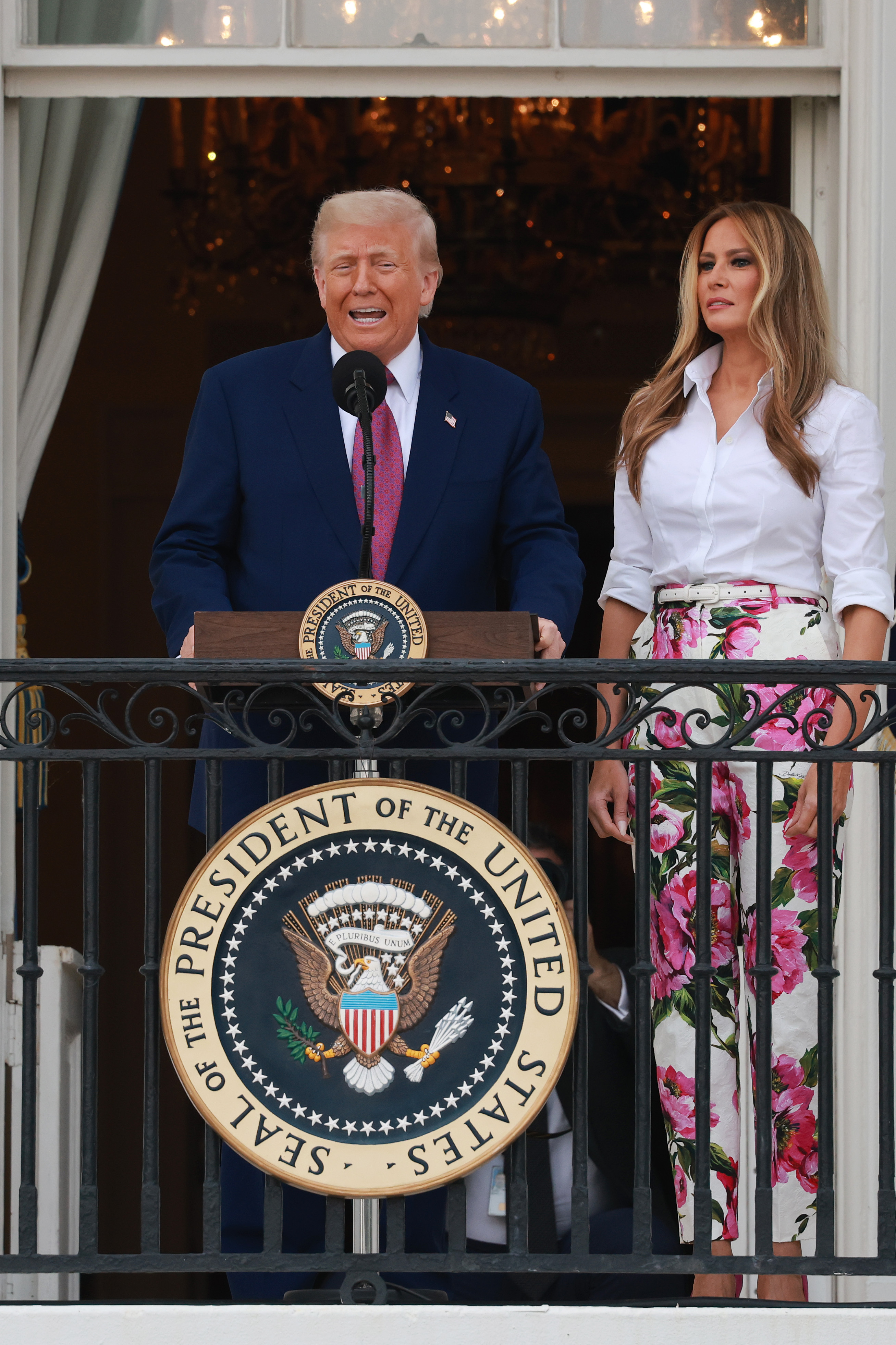 Donald Trump addresses members of Congress alongside Melania Trump, during the Congressional Picnic on the South Lawn of the White House on June 12, 2025 in Washington, DC | Source: Getty Images