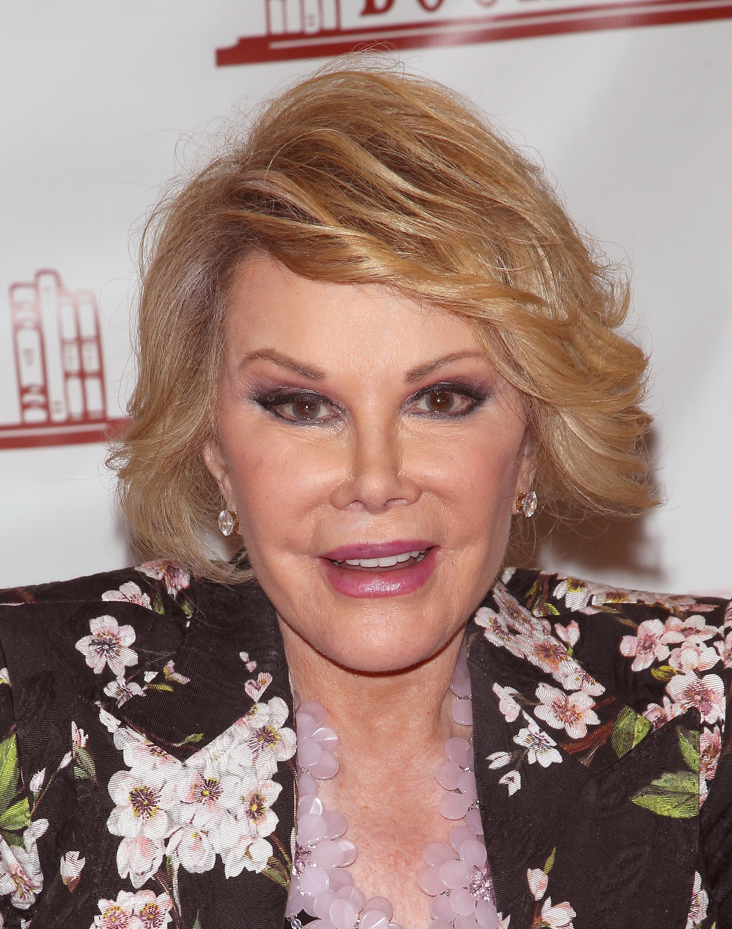 Joan Rivers promotes her book "Diary of a Mad Diva" at Bookends Bookstore in Ridgewood, New Jersey, on July 1, 2014. | Source: Getty Images
