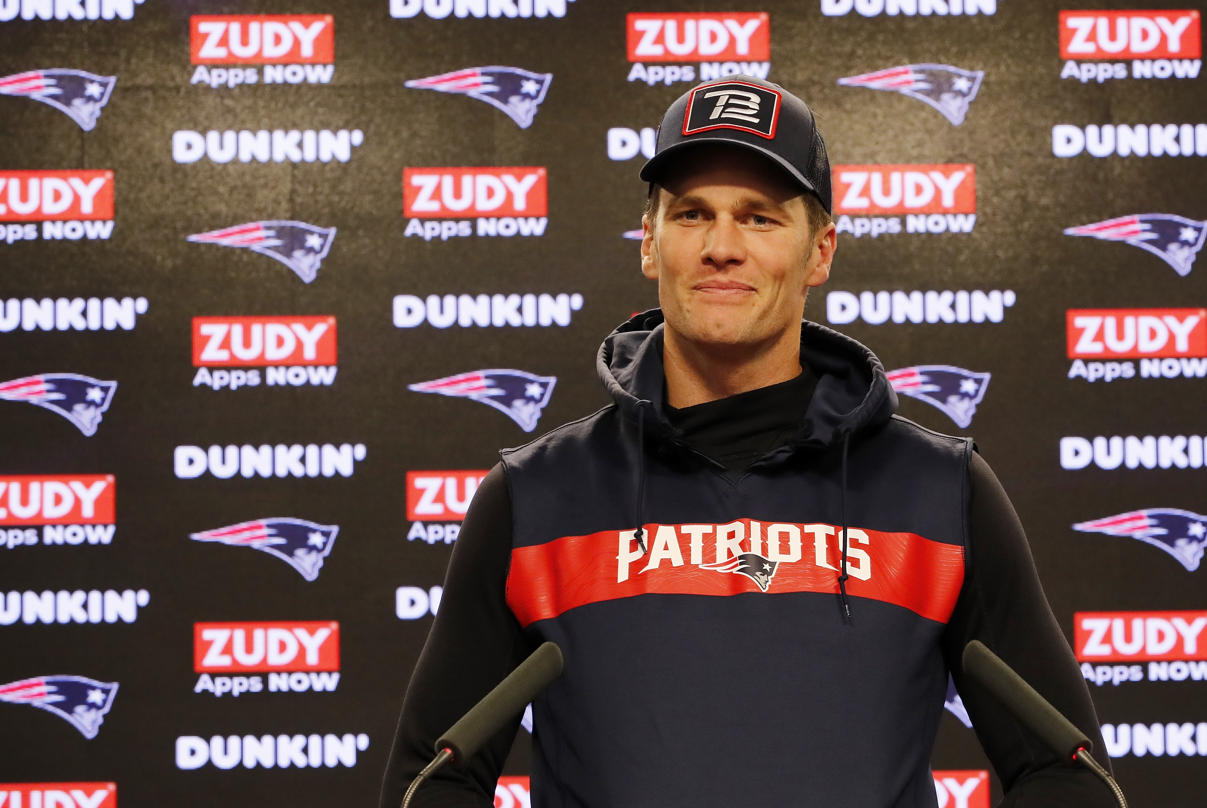 With a sweet smile, Tom Brady addressed the media during press conferences ahead of the AFC Wild Card Game between the New England Patriots and the Tennessee Titans at Gillette Stadium in Foxborough, Massachusetts.