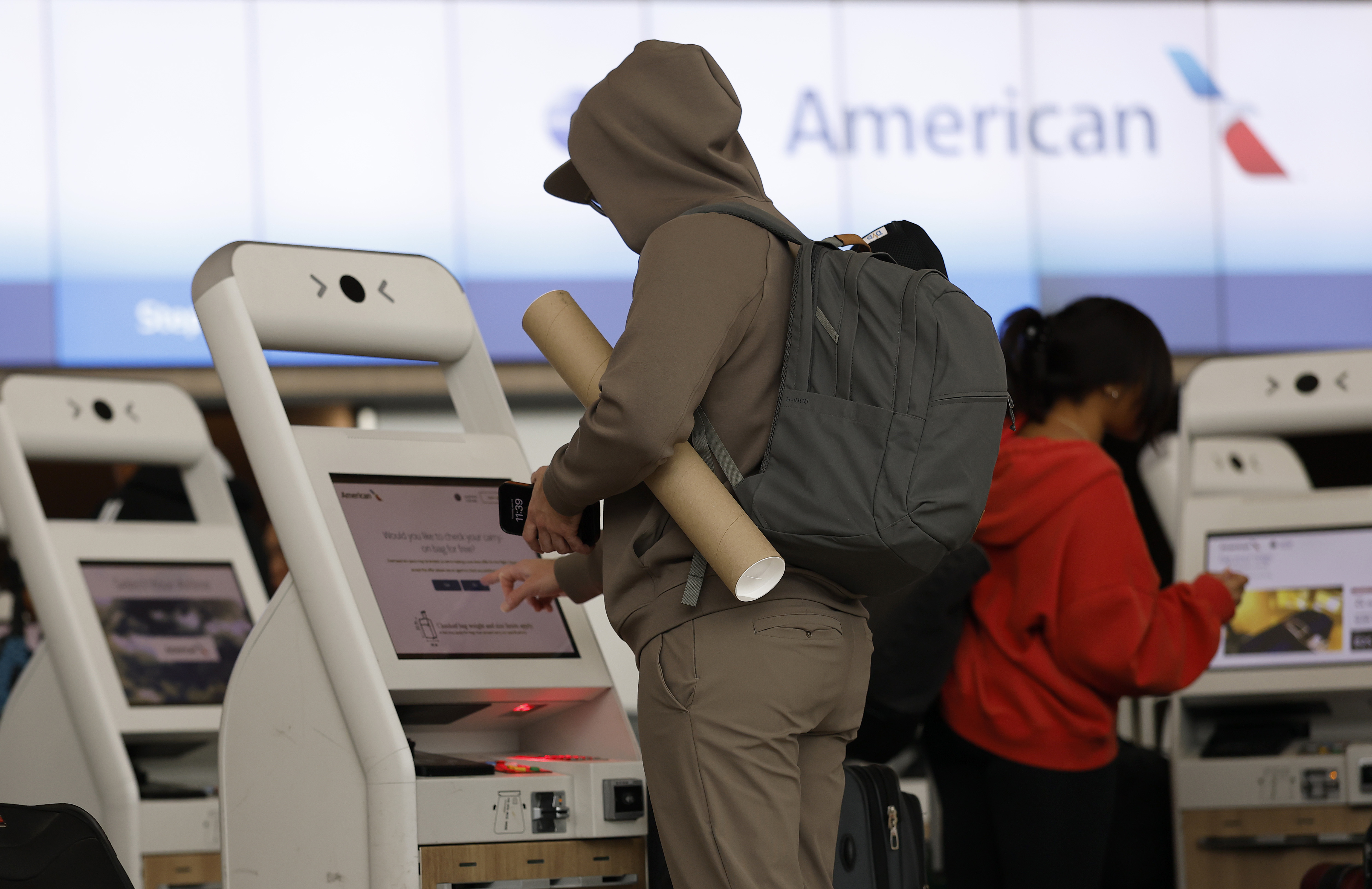 Passengers check in for an American Airlines flight at San Francisco International Airport on April 24, 2025 | Source: Getty Images