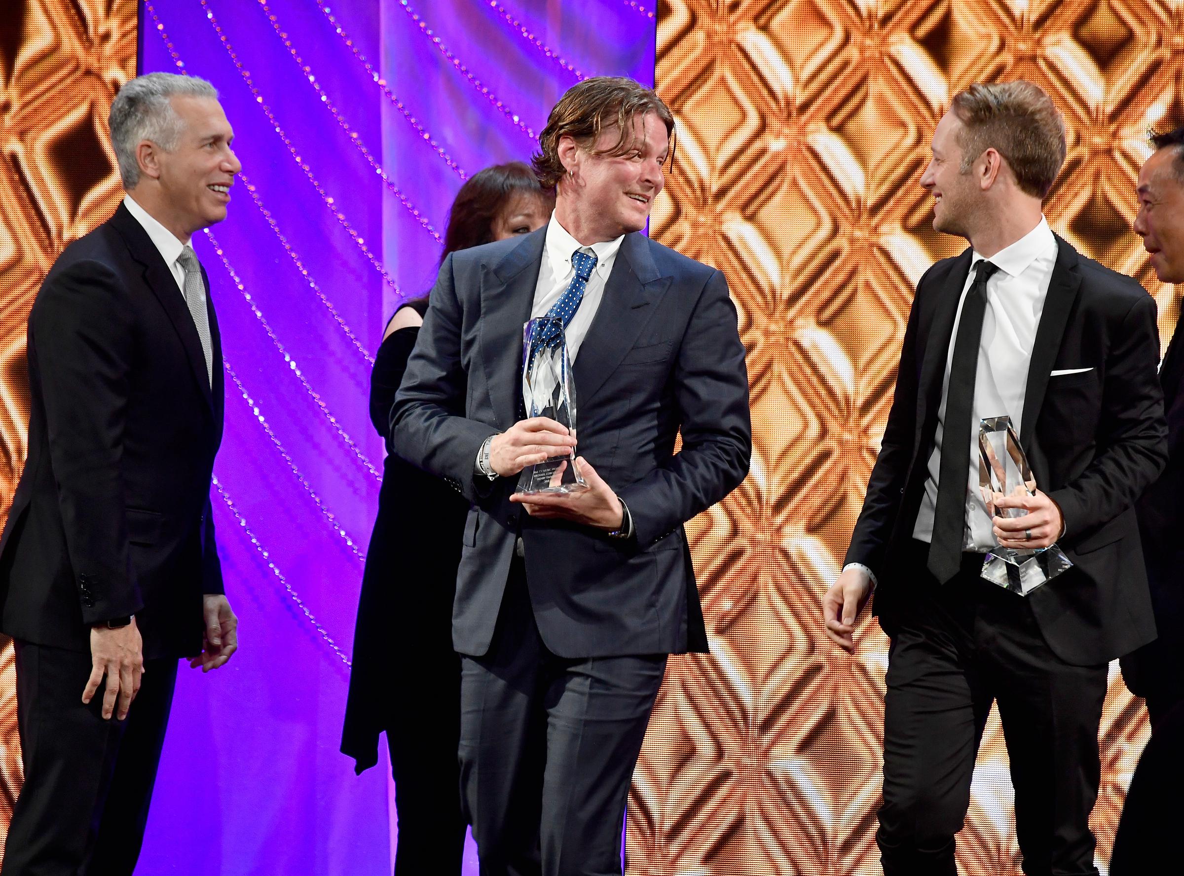 Michael Corcoran accepting an award during the 34th Annual BMI Film, TV & Visual Media Awards at Regent Beverly Wilshire Hotel on May 9, 2018, in Beverly Hills, California. | Source: Getty Images