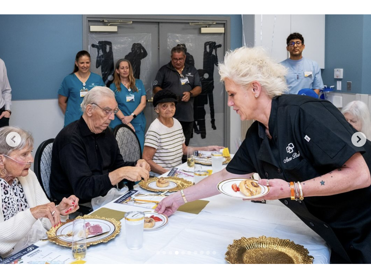 Anne Burrell is seen serving food to the elderly residents, dated June 11, 2025 | Source: Instagram/careritecenters