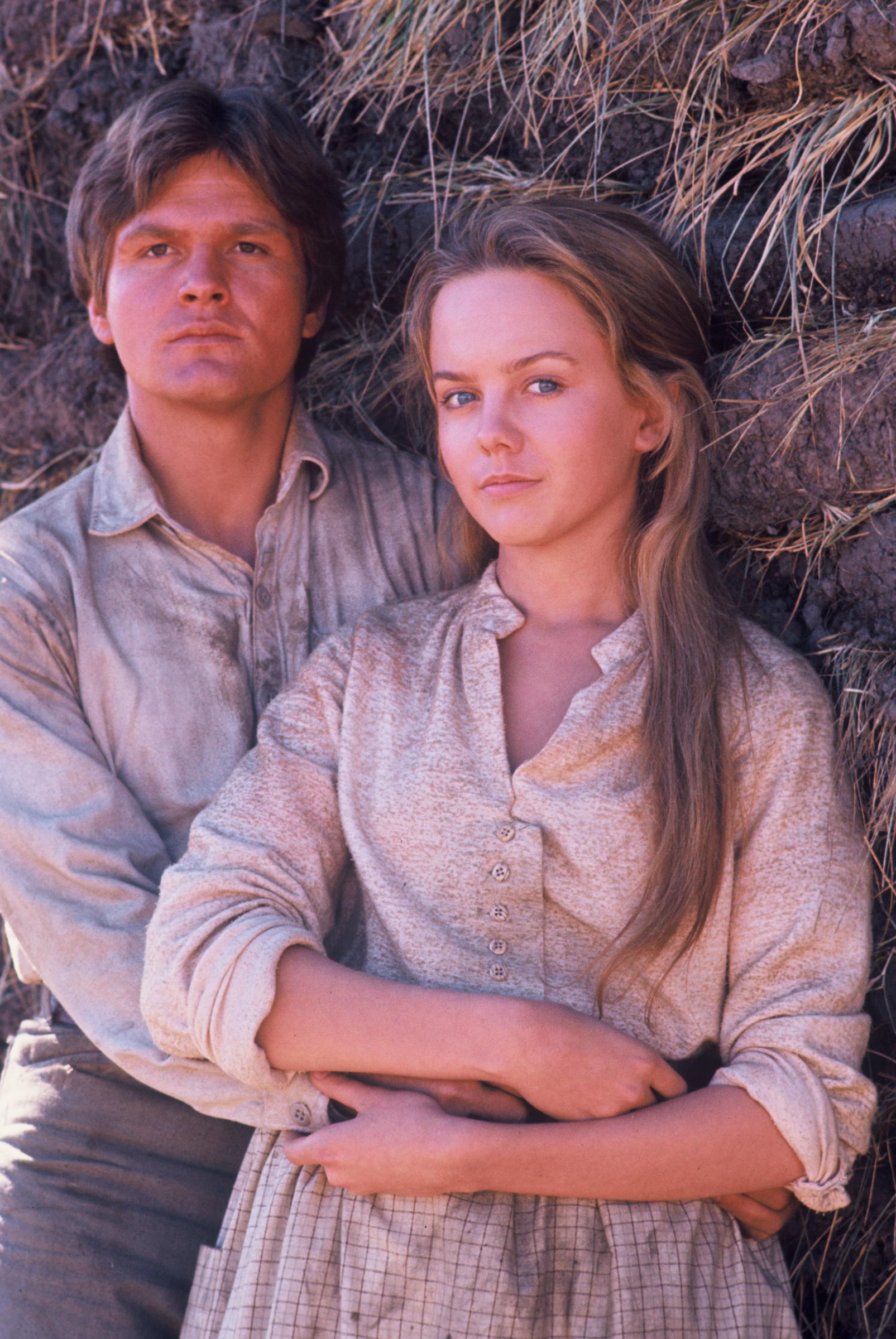 At just 20 years old, Linda Purl radiated youthful vulnerability alongside co-star Roger Kern for the 1976 television movie "The Young Pioneers". Her full, round cheeks and wide-set eyes captured a distinctly tender, adolescent innocence, set off by a simple homespun calico dress and long, sun-bleached brown hair cascading loosely over one shoulder.