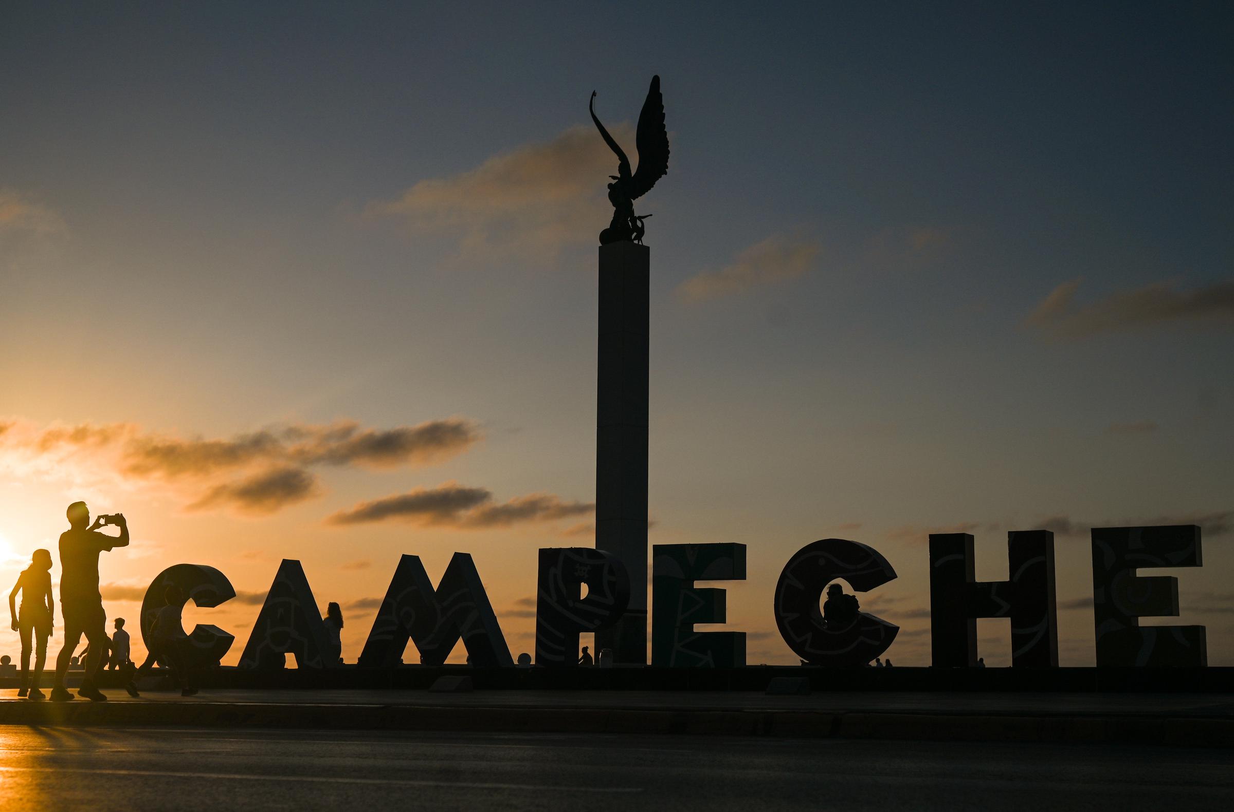 Visitors take photos in front of city name letters in San Francisco de Campeche, Mexico, on March 16, 2022 | Source: Getty Images