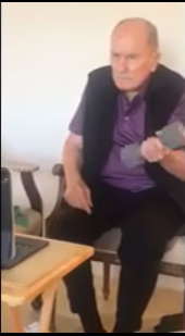 A screenshot taken from a video showing Robert Duvall lifting a weight. | Source: Facebook/Robert Duvall