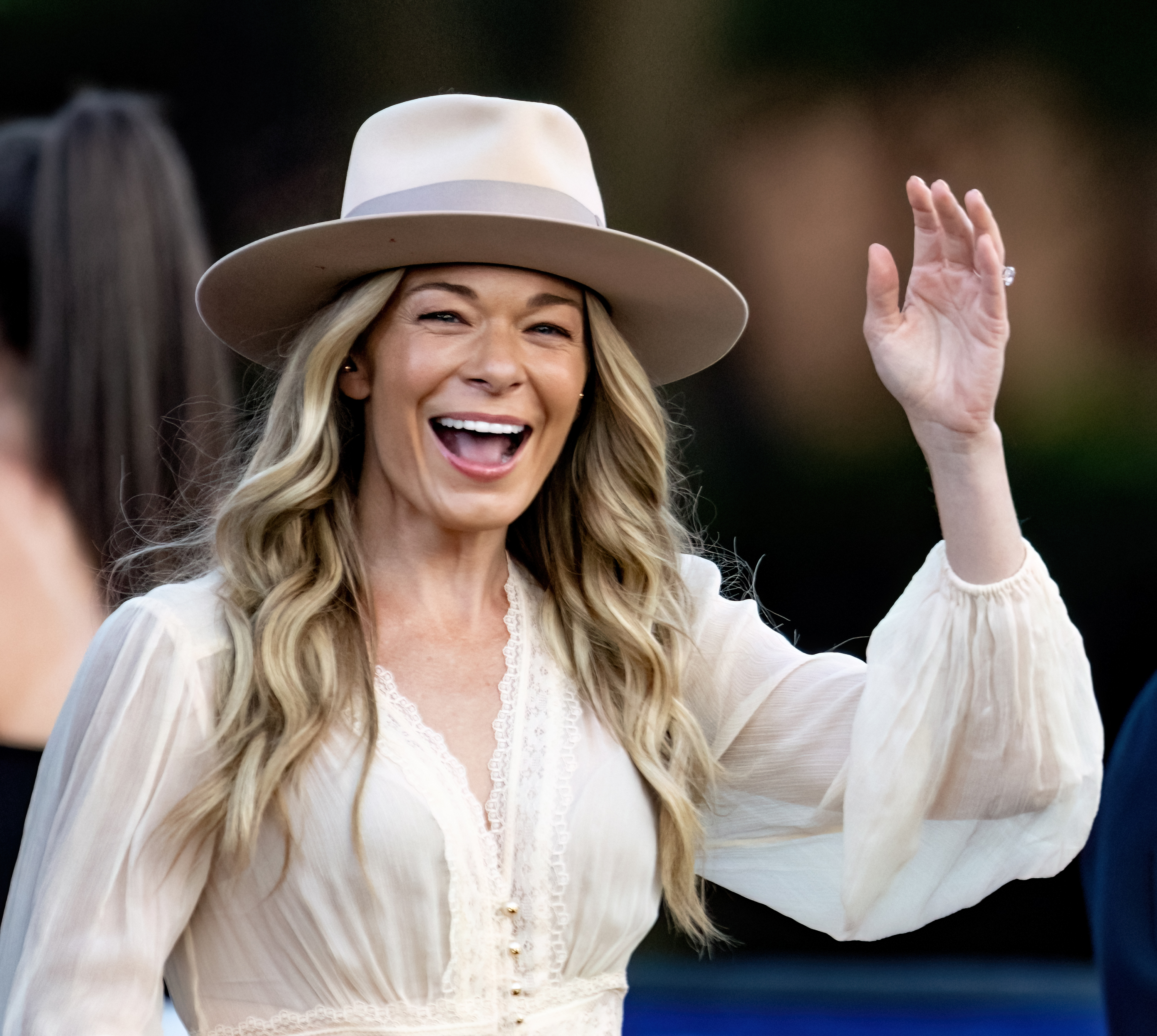 Leann Rimes waves while attending the Salute to Service event featuring the United States Army Field Band in Philadelphia, Pennsylvania on July 3, 2024 | Source: Getty Images