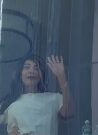 Wendy Williams waves from her window inside her senior living facility, posted on March 19, 2025 | Source: Instagram/tmz_tv