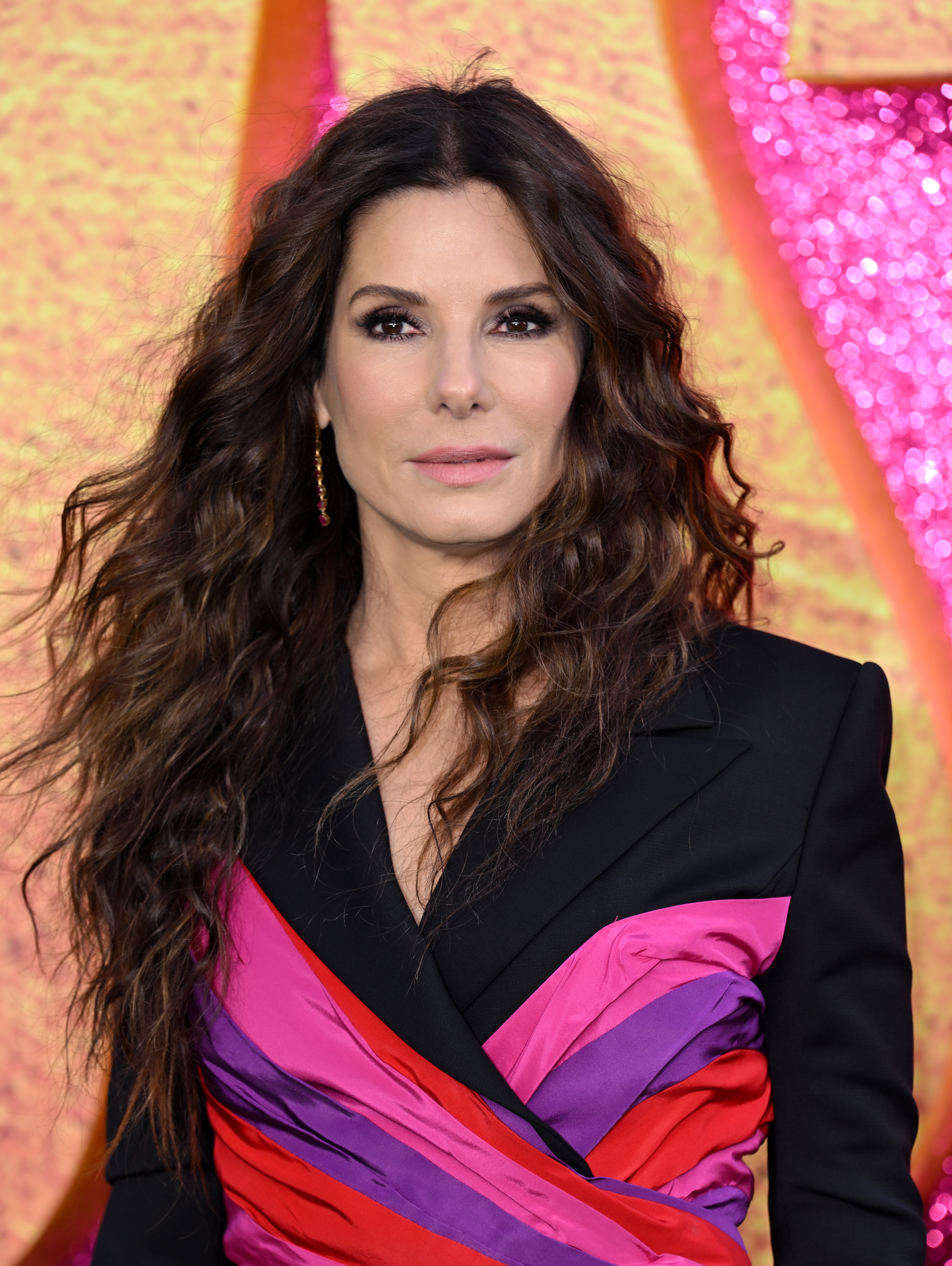 Sandra Bullock attends a UK screening in London, posing against a bright, textured backdrop during the event | Source: Getty Images