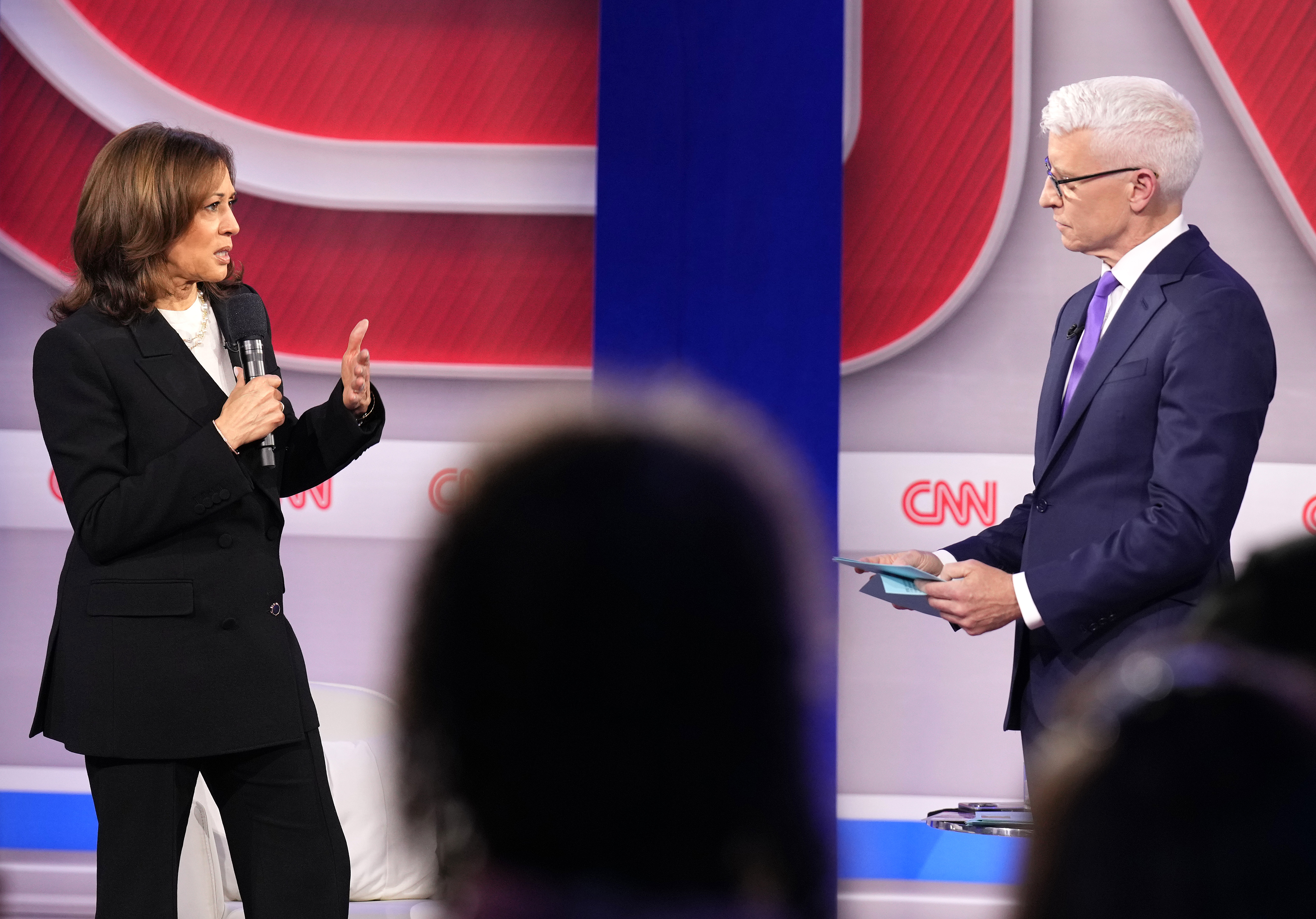 Kamala Harris talks with CNN moderator Anderson Cooper during a Presidential Town Hall event at Sun Center Studios in Aston, Pennsylvania, on October 23, 2024 | Source: Getty Images
