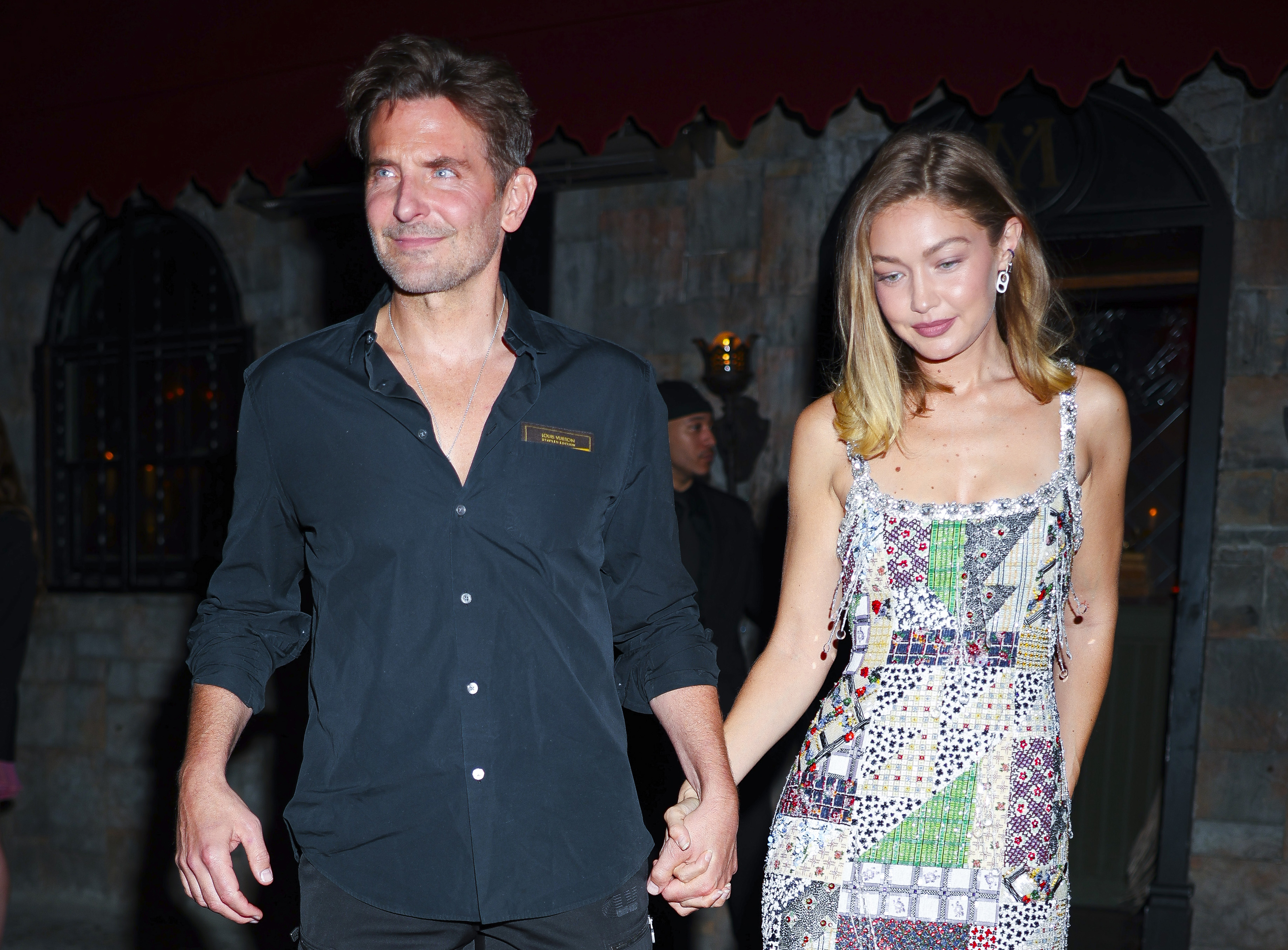 Cooper projected a smoldering gaze beneath his brow with a shadow of stubble covering his jawline and upper lip, creating a slight contrast with his smooth forehead. His signature stuble was gone, giving his face a seemingly longer appearance as he was seen holding hands with Gigi Hadid at the Vogue October issue cocktail party at Monsieur in the East Village on September 14, 2025, in New York City. His jawline also looked slightly different from his previous images.