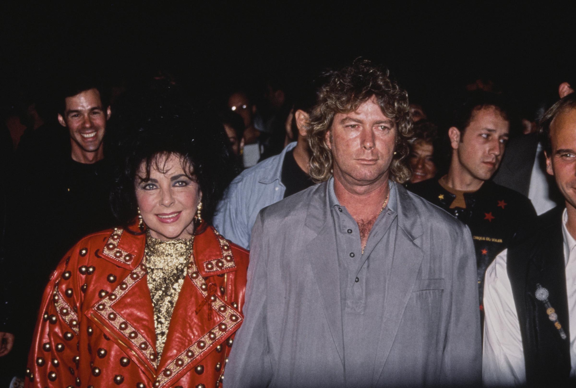Elizabeth Taylor and her husband, Larry Fortensky, attend an event circa 1992, in Los Angeles, California | Source: Getty Images