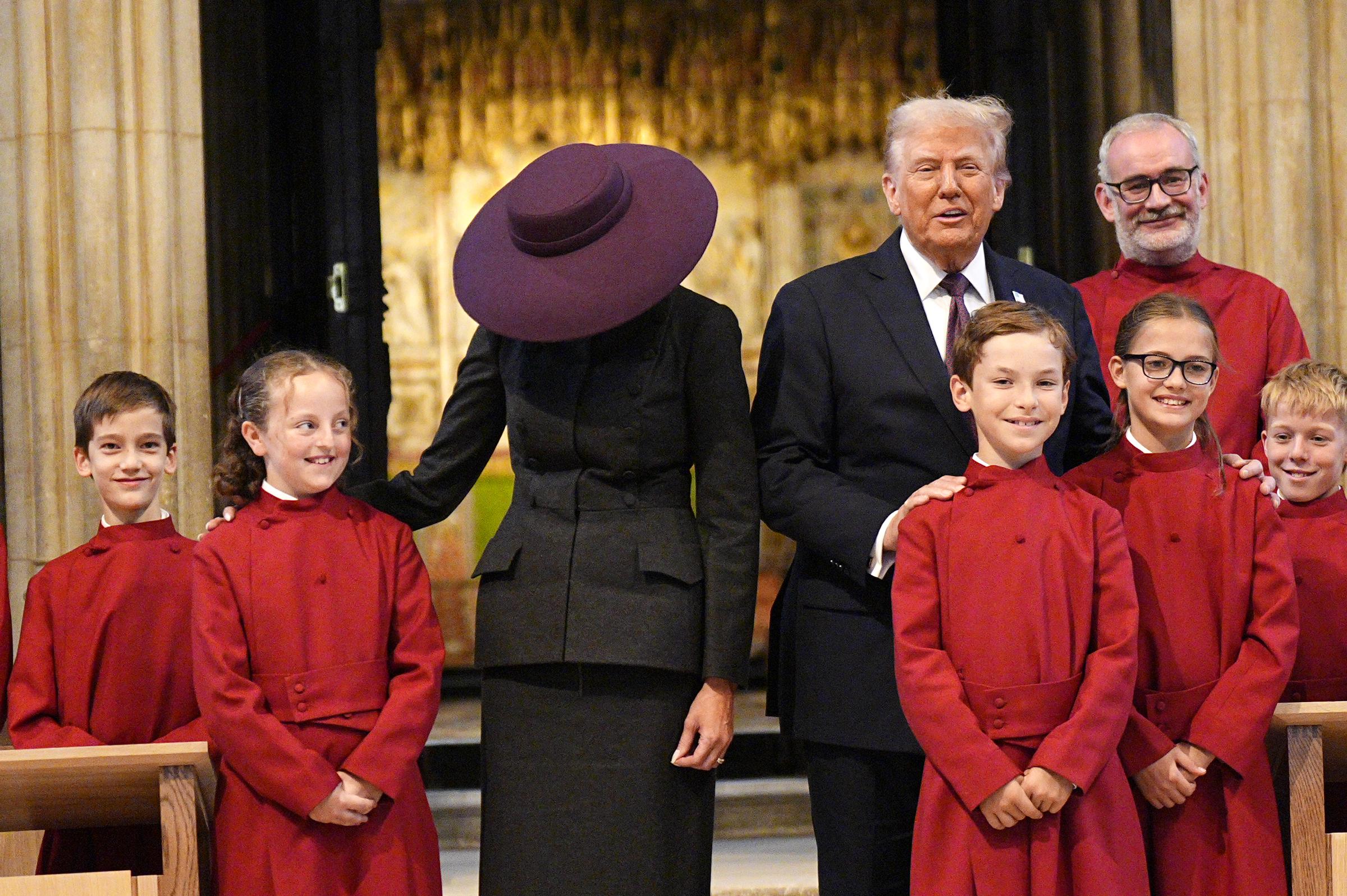 Donald and Melania Trump meeting young members of the choir during their visit to St. George's Chapel at Windsor Castle on September 17, 2025, in England. | Source: Getty Images