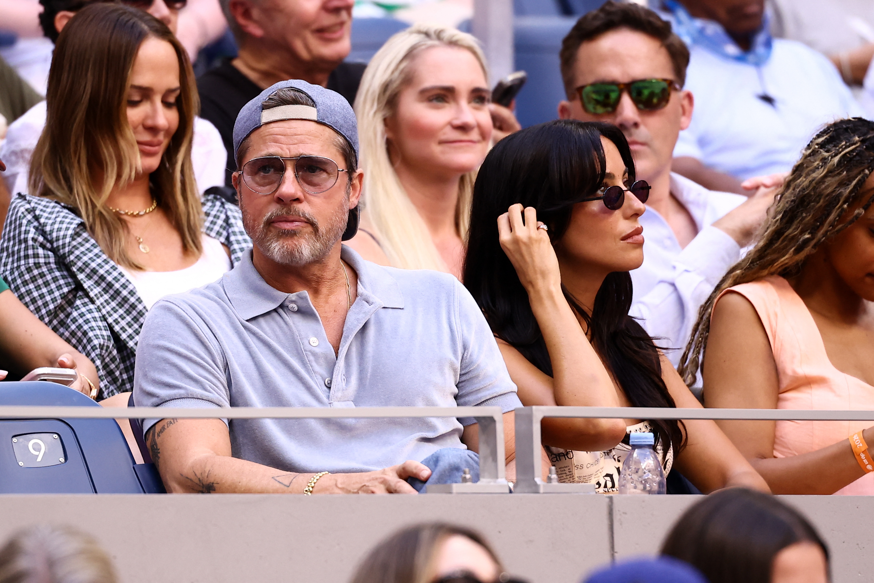 Brad Pitt and Ines de Ramon attended Day 14 of the 2026 US Open in New York City on September 12. They watched the women's singles final between Aryna Sabalenka and Elena Rybakina from the stands.