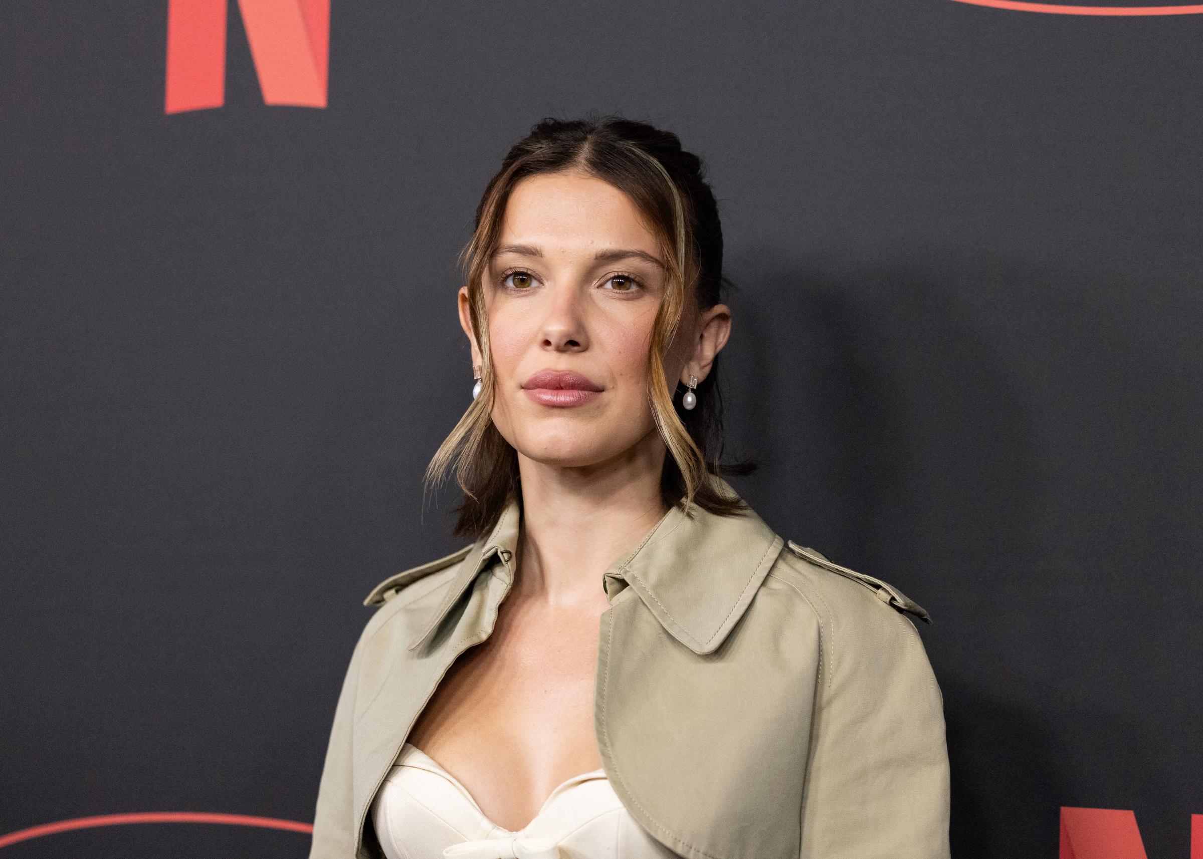 Millie Bobby Brown attended the Netflix 2026 Upfront Red Carpet in New York City on May 13, 2026. The following month, she spoke openly about expanding her family and why adoption had been part of her plans since childhood. | Source: Getty Images