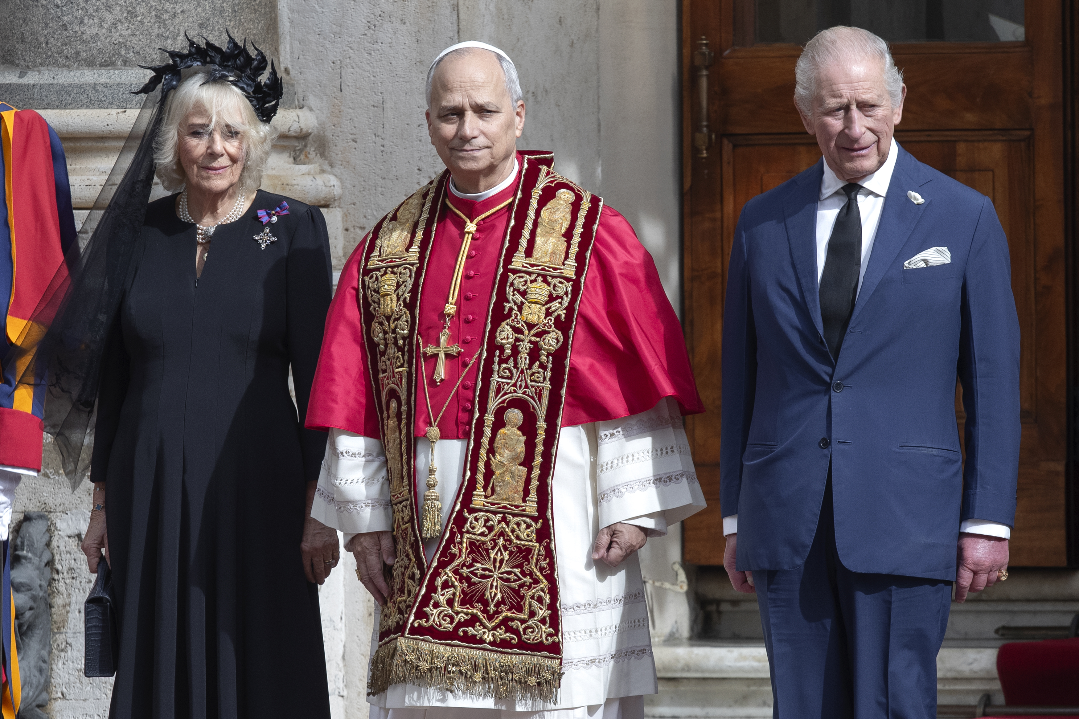 Queen Camilla, Pope Leo XIV, and King Charles III pose in the San Damaso courtyard at the Vatican after the state visit and praying together in the Sistine Chapel | Source: Getty Images