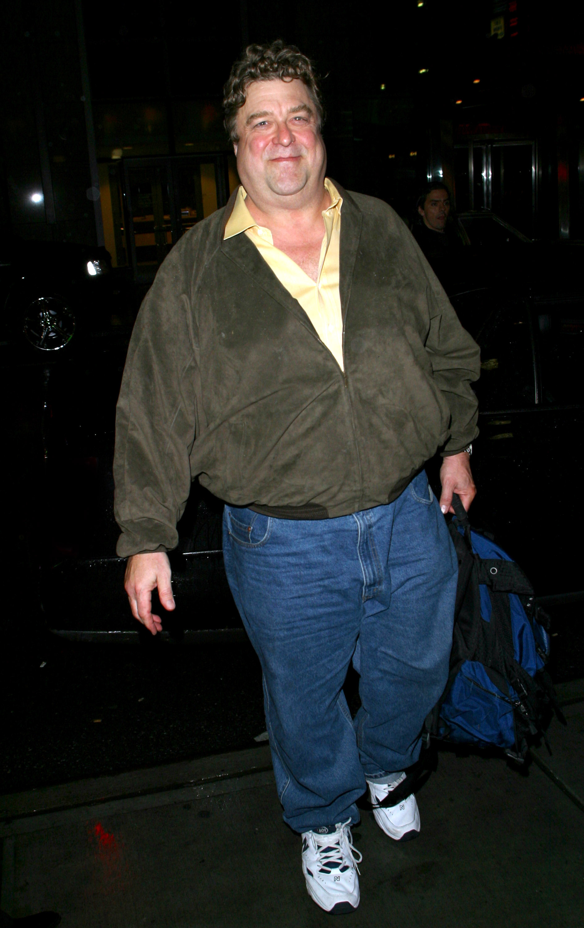 Goodman was spotted leaving an undisclosed location at night. He carried a blue and black bag in his left hand while sporting denim trousers, a dark colored jacket worn over a yellow T-shirt.