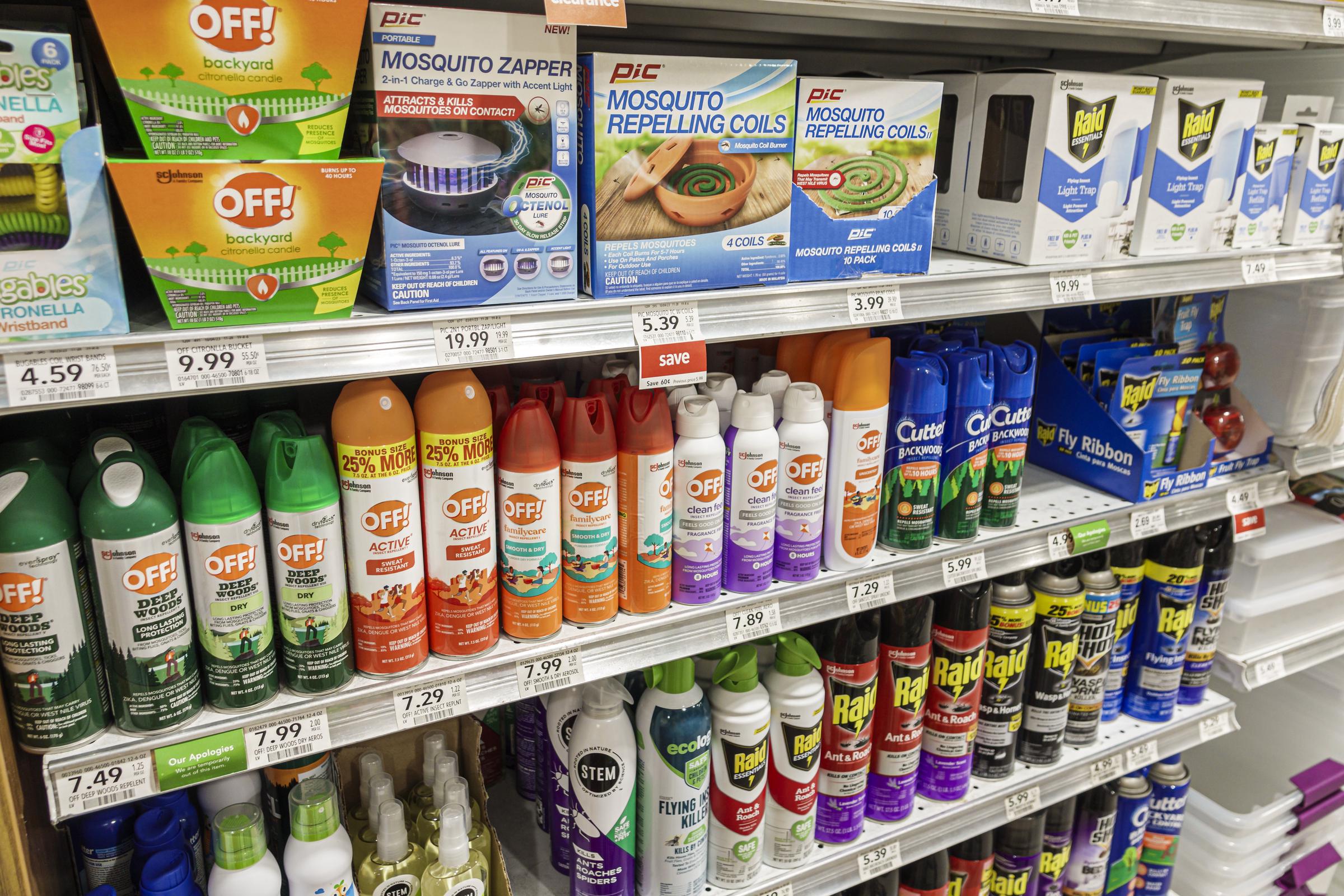Shelves packed with a variety of over-the-counter mosquito repellent products from various brands. | Source: Getty Images