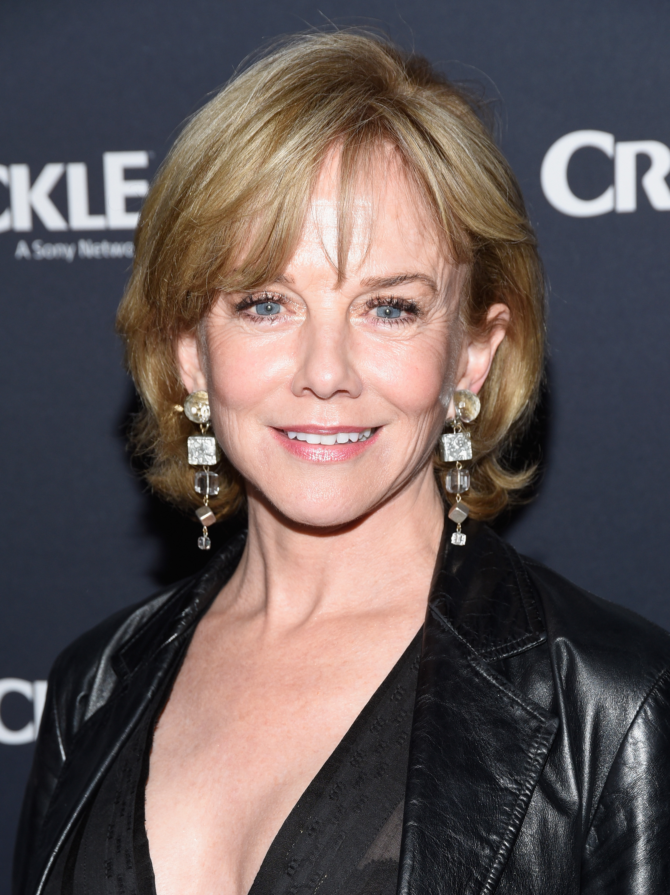 Radiating poised elegance at age 62, Linda Purl attended the premiere of Crackle's "The Oath" at Sony Pictures Studios on March 7, 2018, in Culver City, California. A tailored black leather blazer and eye-catching geometric drop earrings framed her bright smile and expressive blue eyes, set off beautifully by a soft, chin-length honey-blonde bob with feathered fringe. | Source: Getty Images